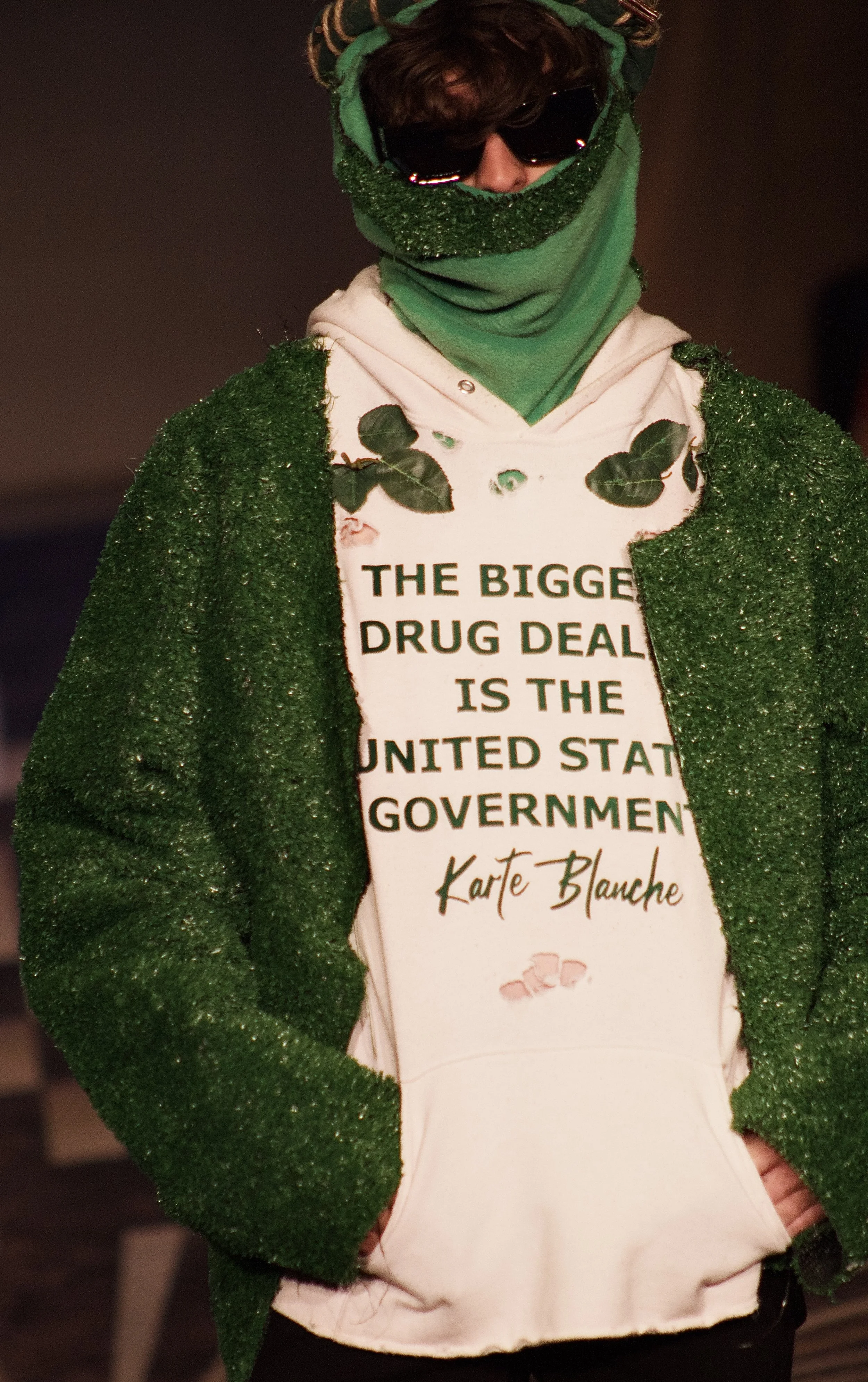 Model wearing descriptive t shirt on runway