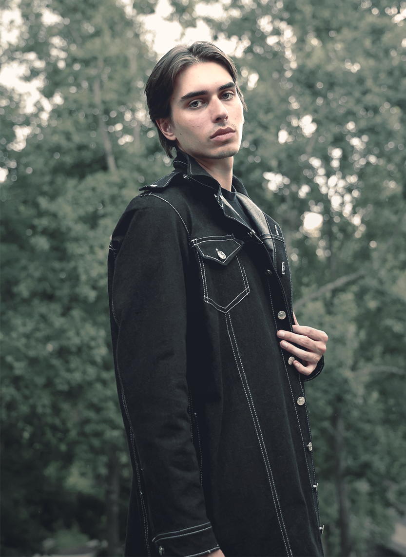 Young man posing in a custom VRTY trench coat
