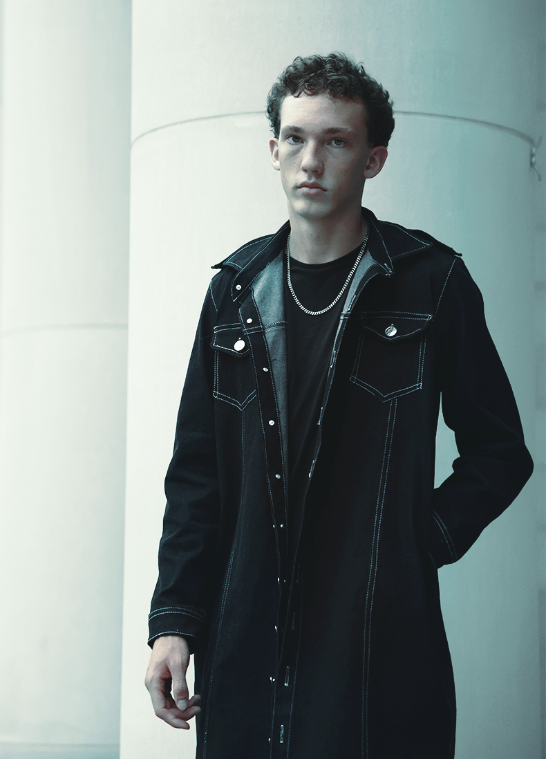 Blue hour editorial shot of boy wearing VRTY jacket