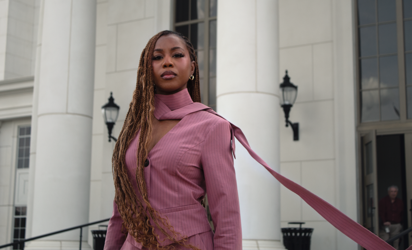 Courtney McClain for Congress standing defiantly in front of Courthouse