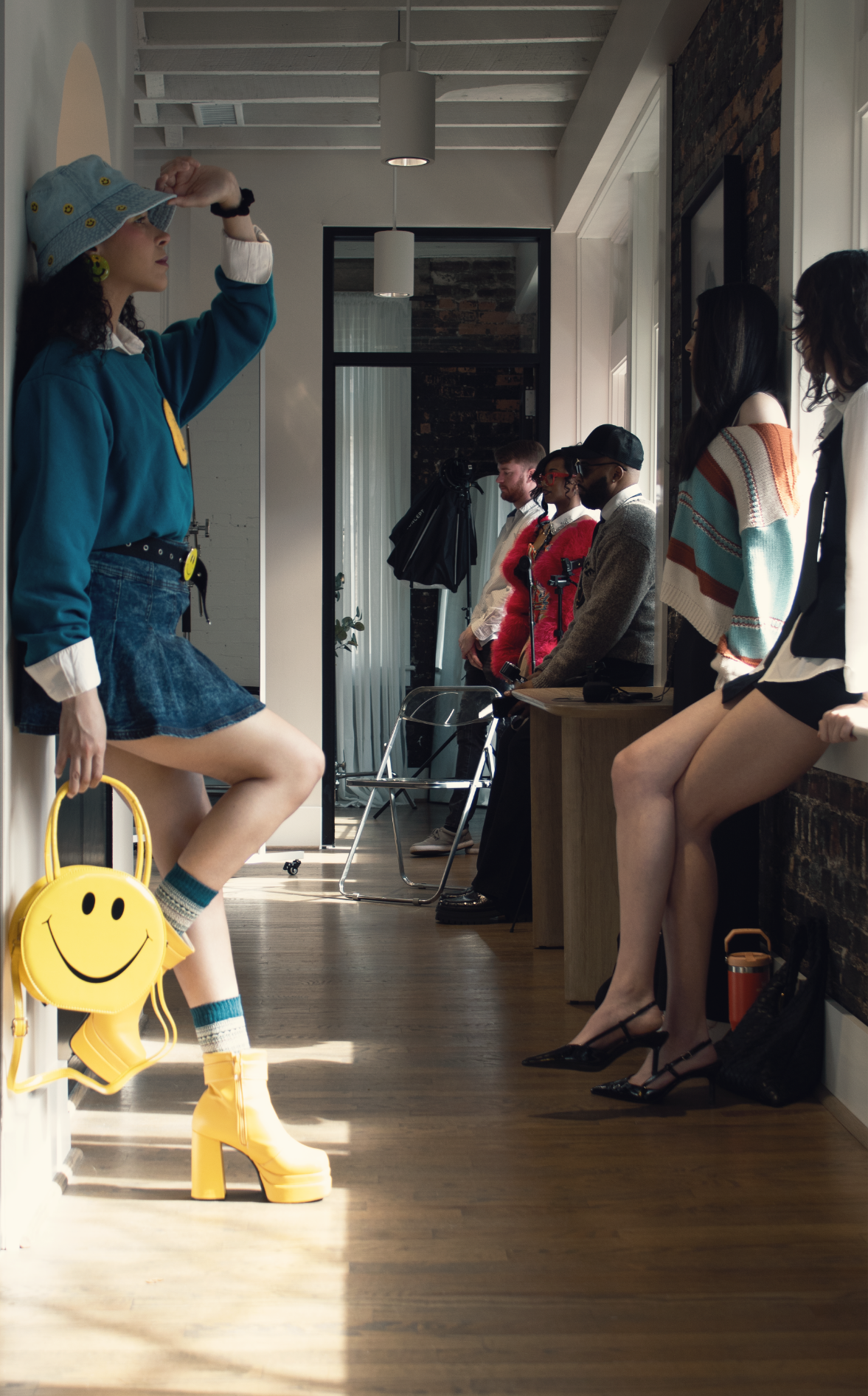 models standing in hallway waiting for an opportunity to join a photo cinematic campaign shoot