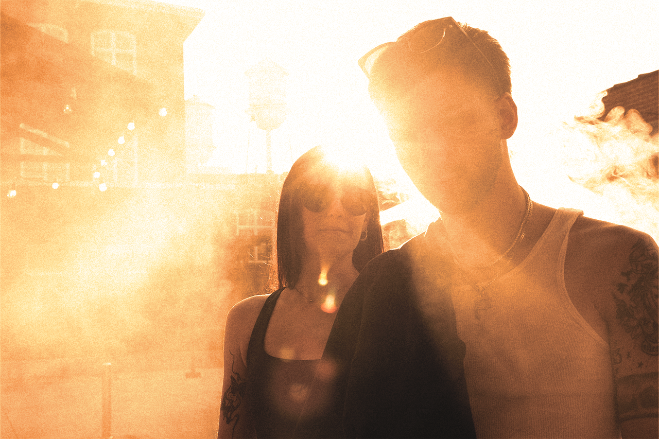 Cinematic picture of a man and a woman looking deep in thought while bathed in light during golden hour lighting