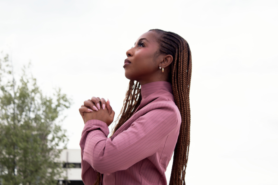 Courtney McClain praying in front of Spartanburg County Courthouse