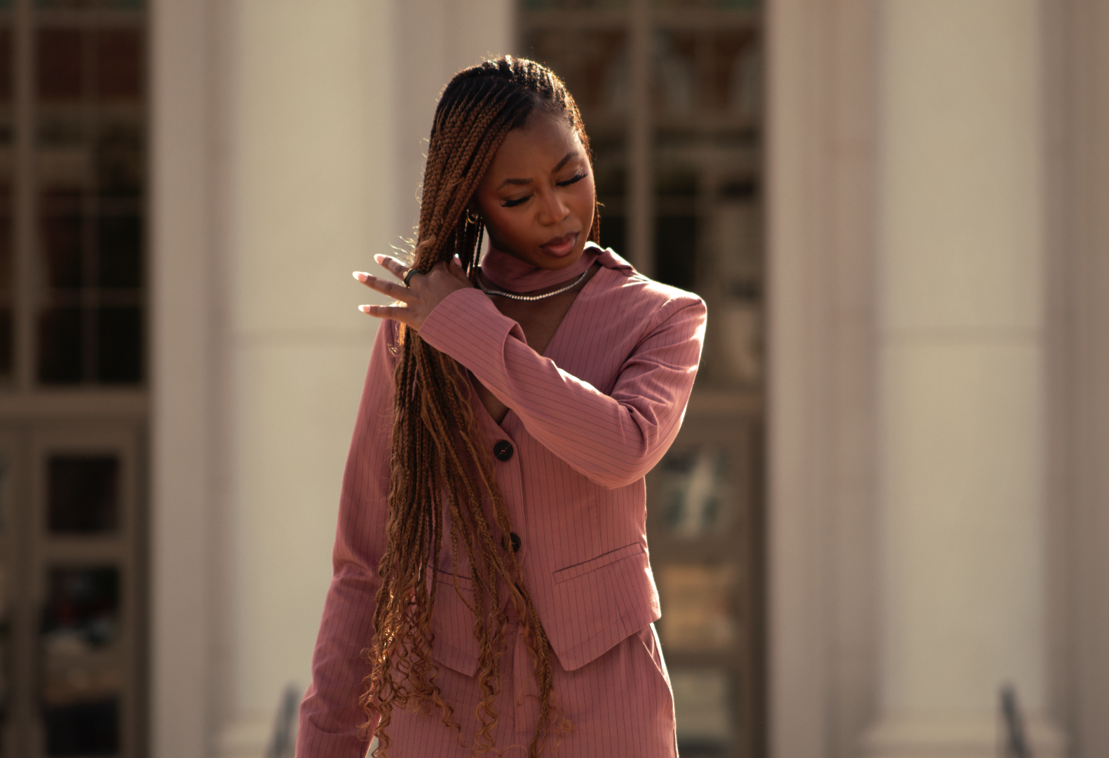 Courtney McClain fixing hair with golden hour lighting