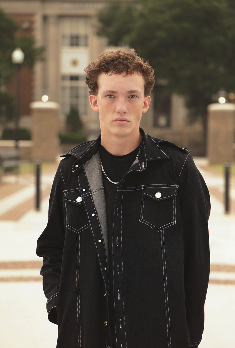 Forward shot of boy wearing VRTY clothing in park