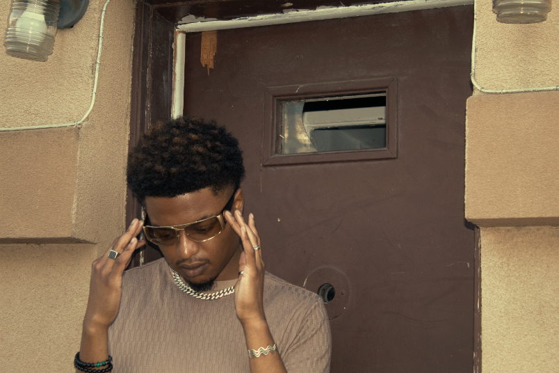 Boy in shades standing in doorway