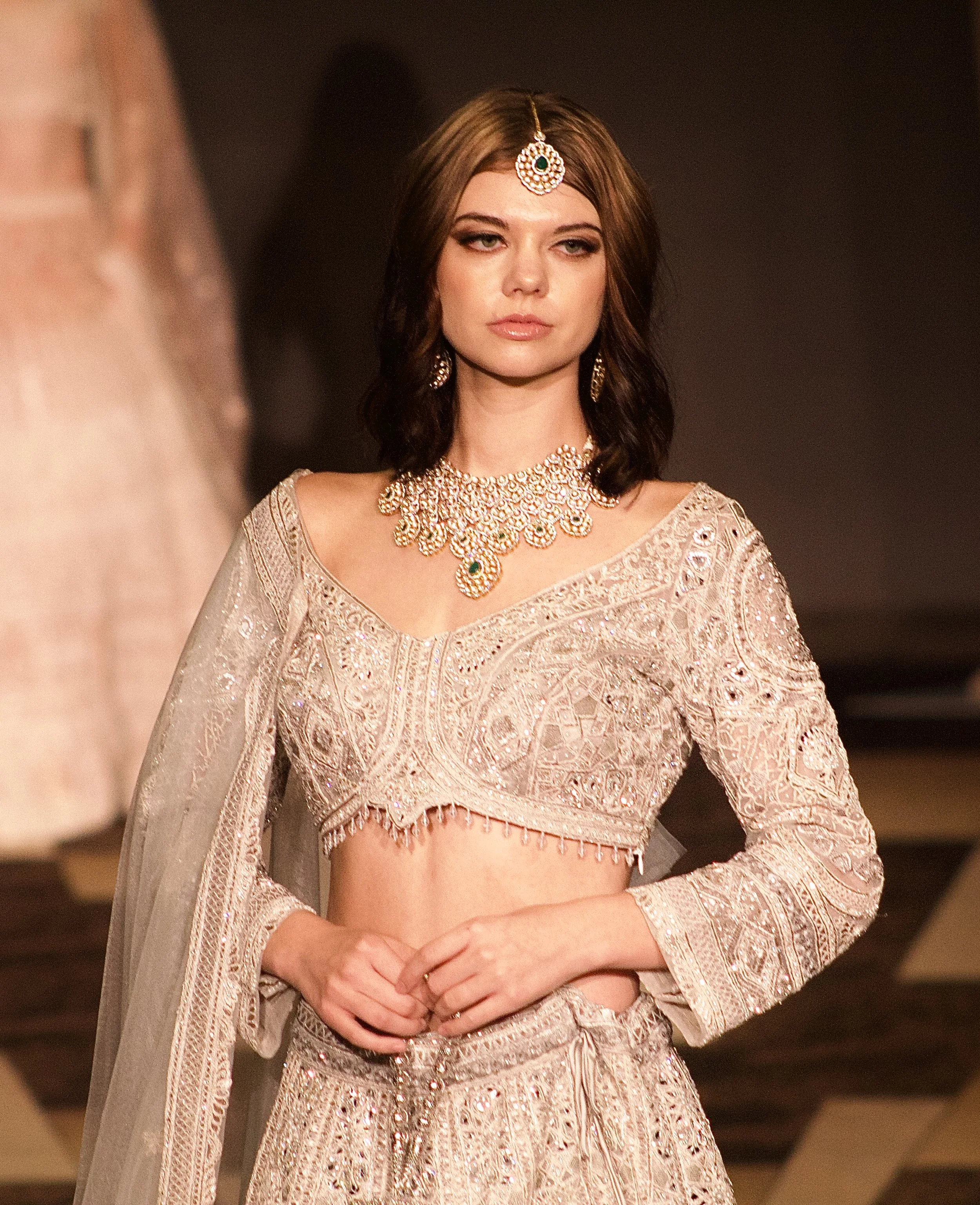 Model wearing Indian-style garment on runway