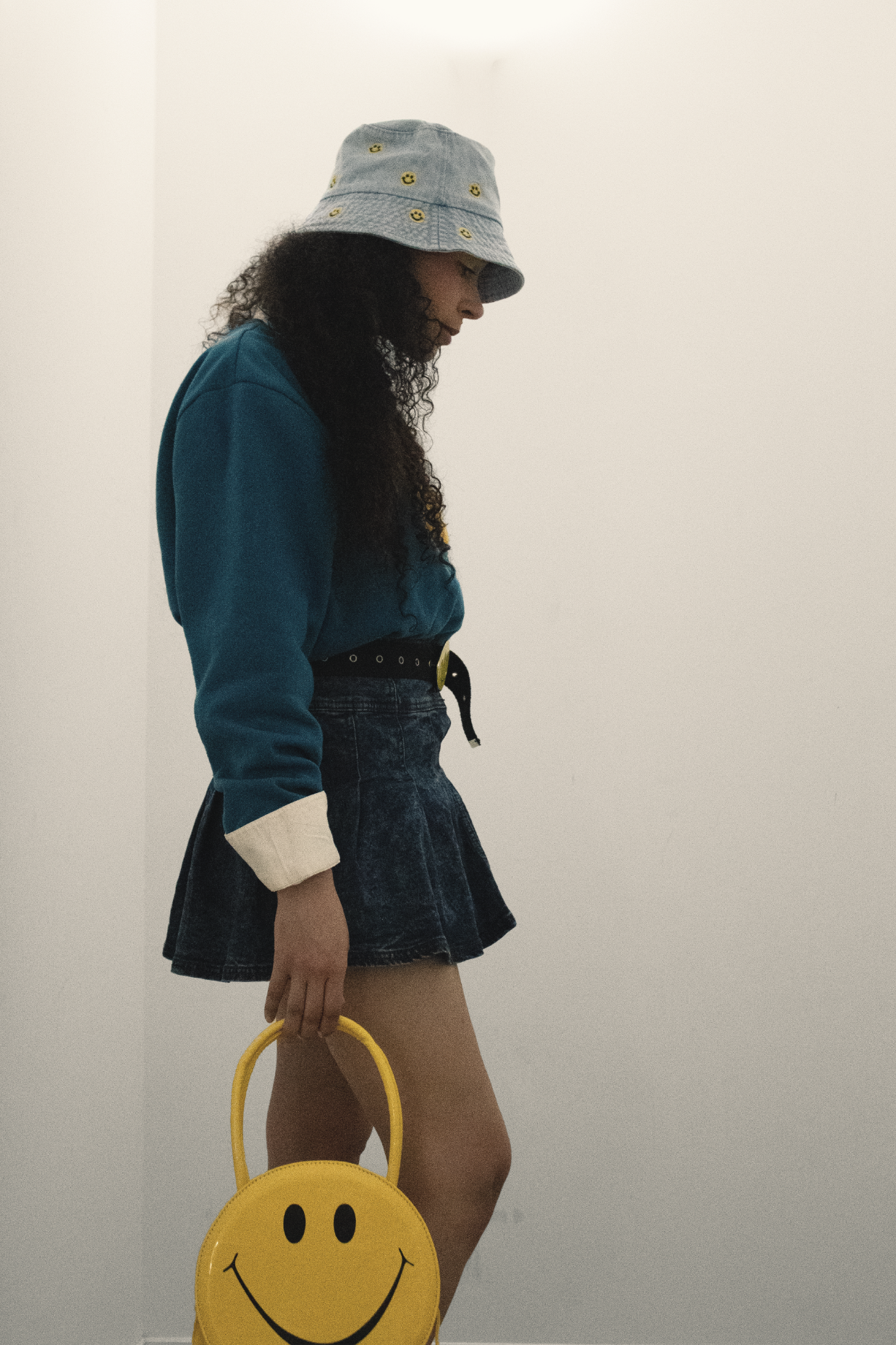 Model deep in thought symbolizing the arthouse lifestyle of introspection