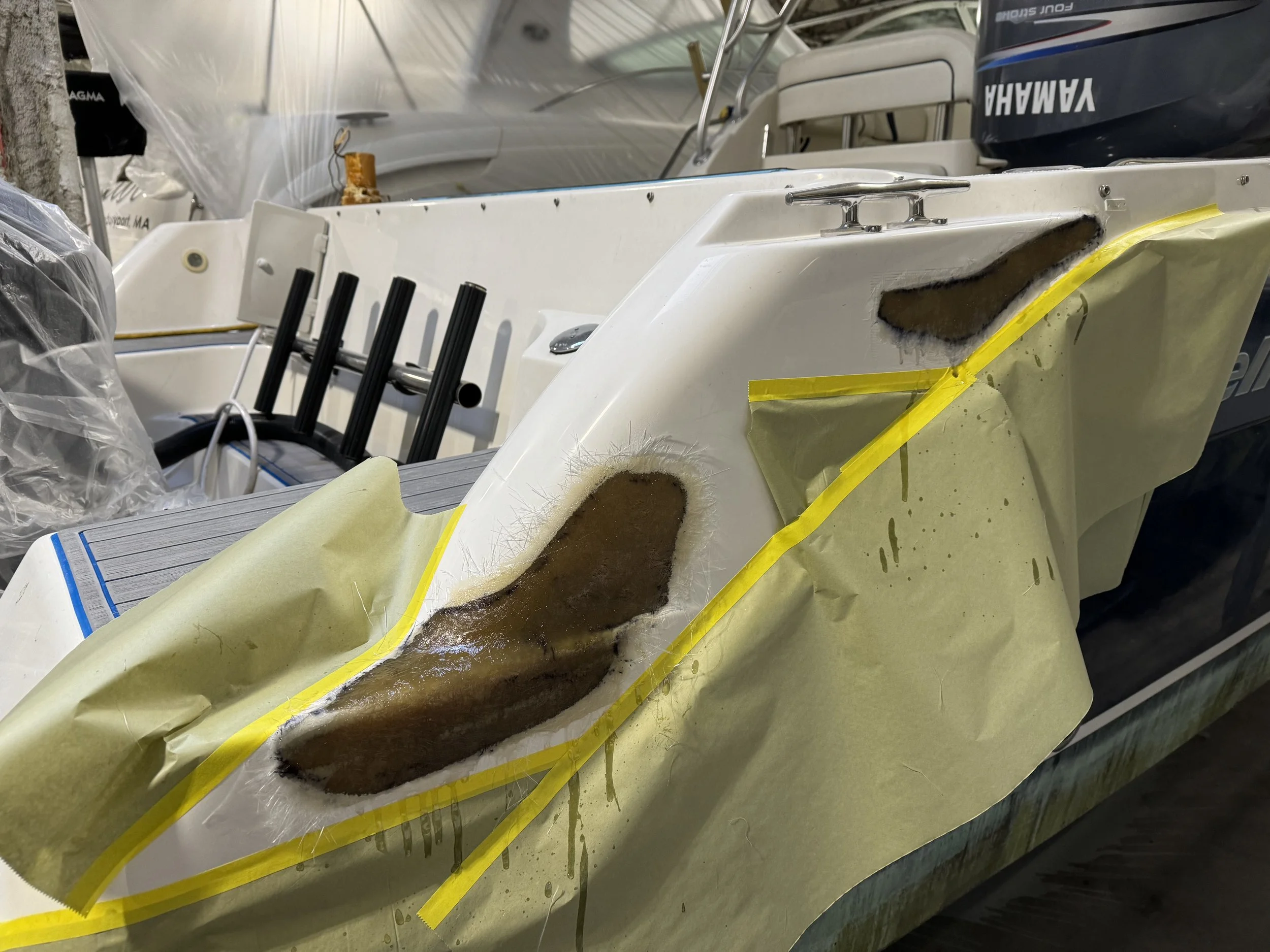 Center console modification: console cut for larger electronic display, Coosa board added, fiberglass applied, gelcoat sprayed, and polished