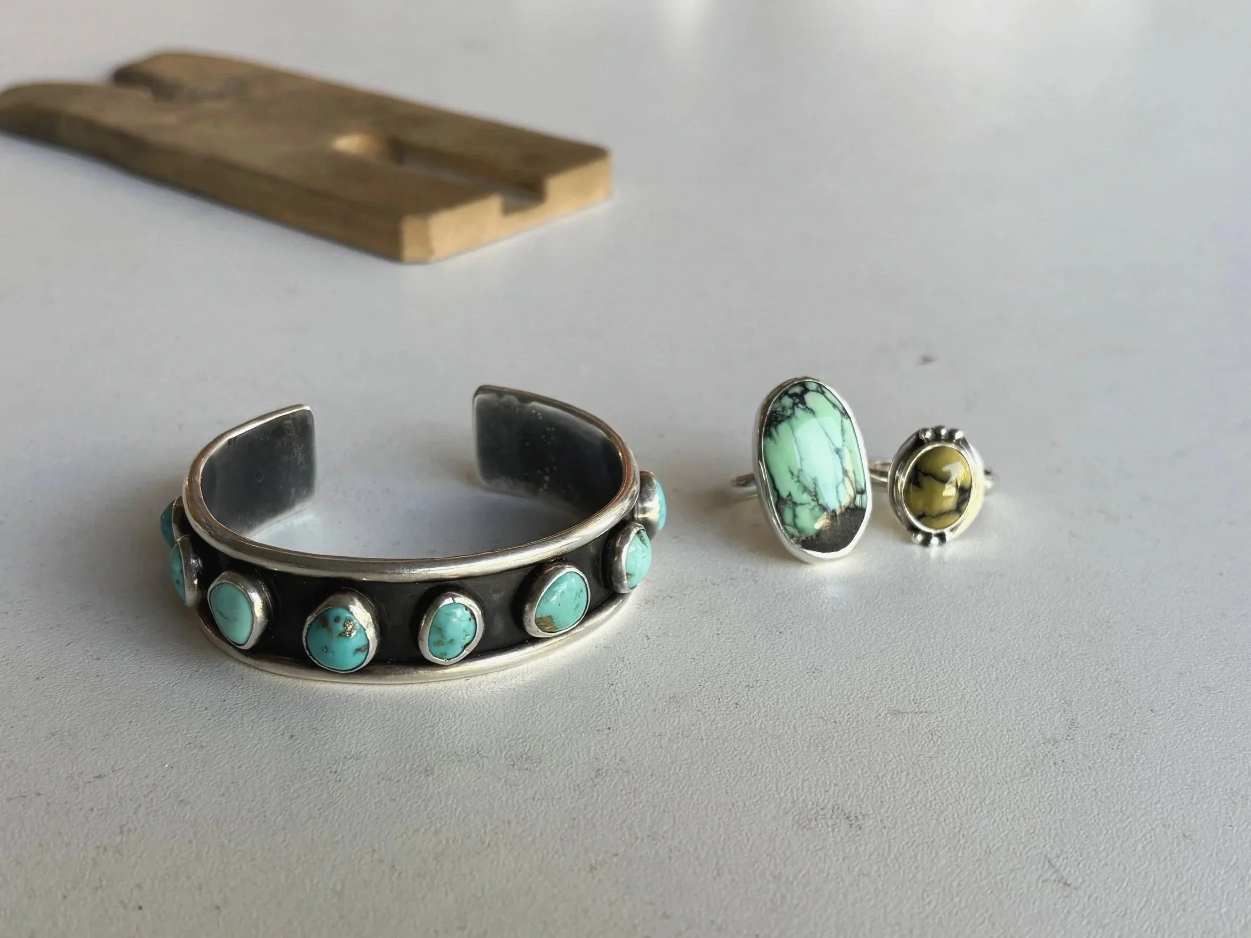 Turquoise cuff, variscite & damele rings.