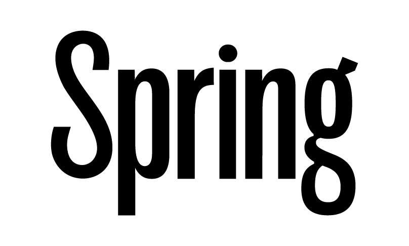 The image shows a black and white line drawing of a person with a large head and small body, sitting on a chair and holding a piece of paper.