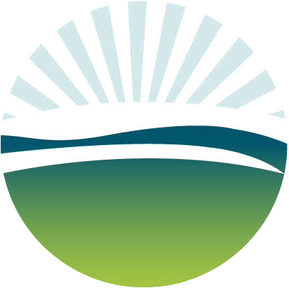A circular logo with a stylized landscape, featuring a blue sky with white rays, a curved dark blue line representing a horizon, and green land below.