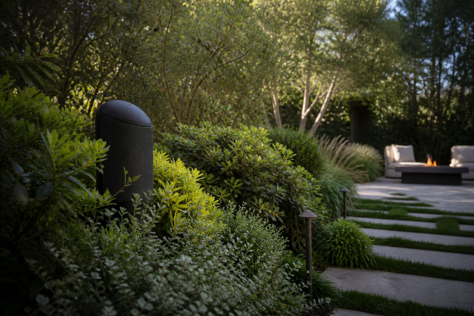 Hidden outdoor audio in a landscaped backyard