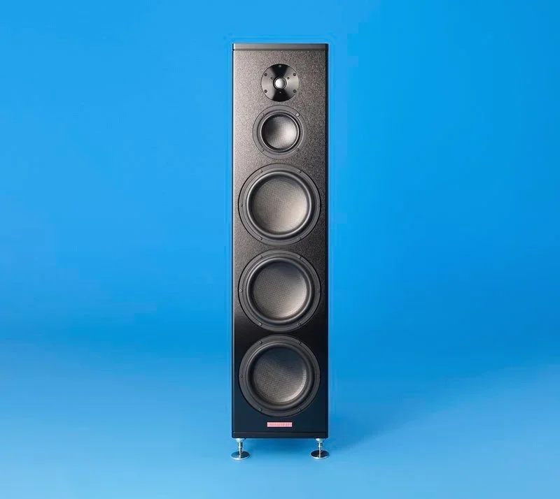A tall black speaker with multiple drivers against a blue background.