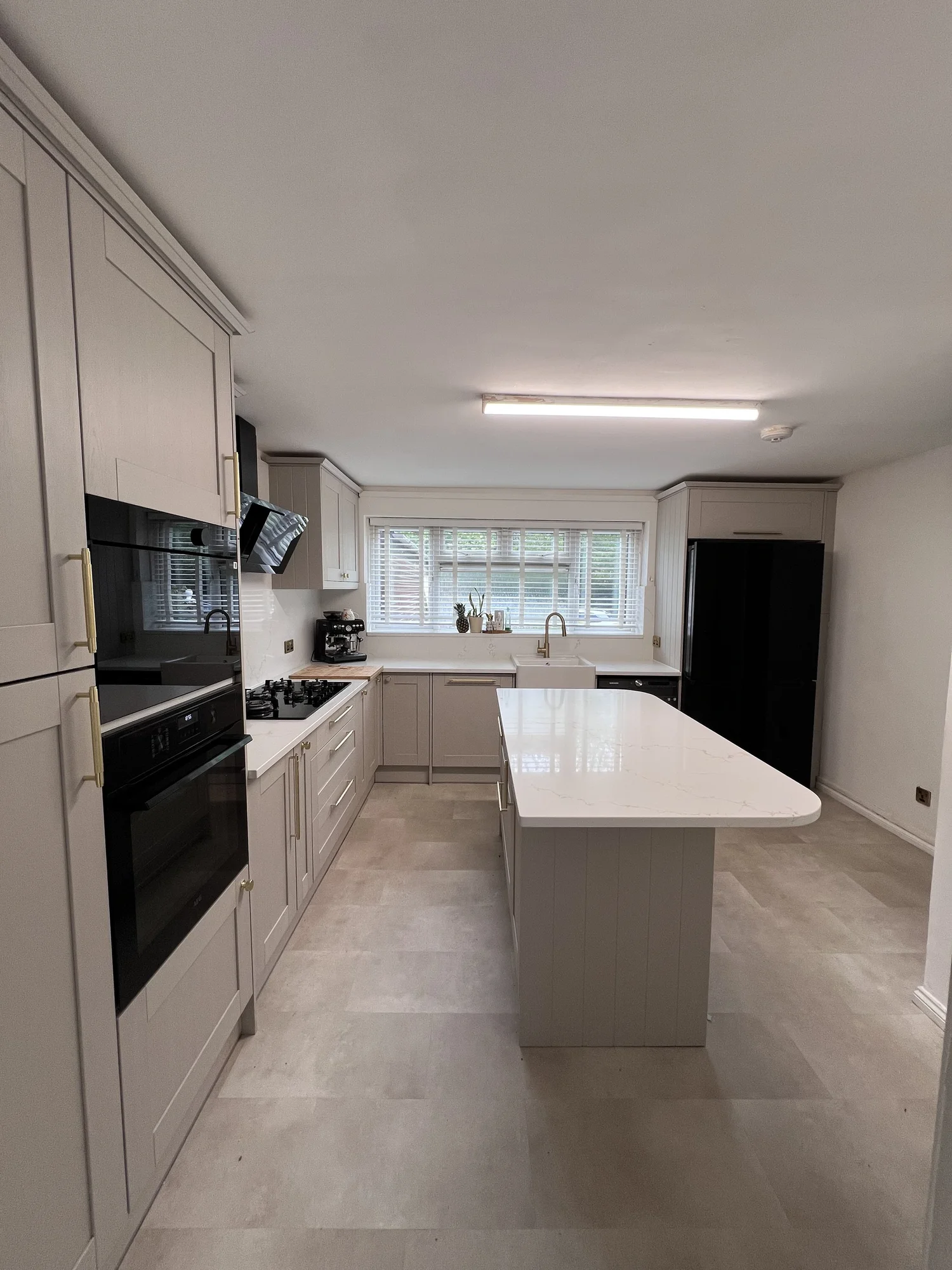 Long view through the Soft Stone Shaker kitchen
