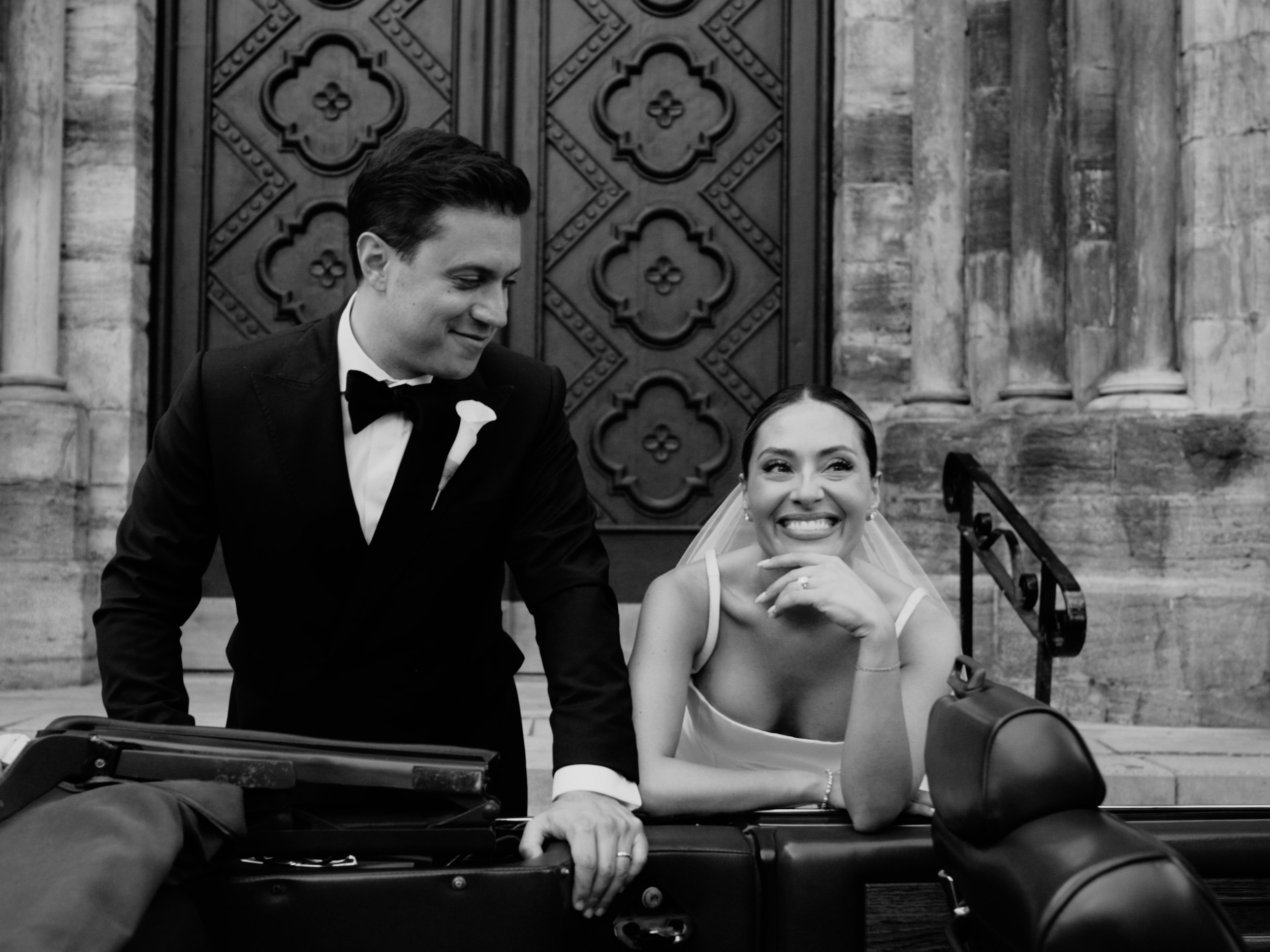 Luxury wedding in Montreal, Quebec. Classy couple standing next to vintage car.