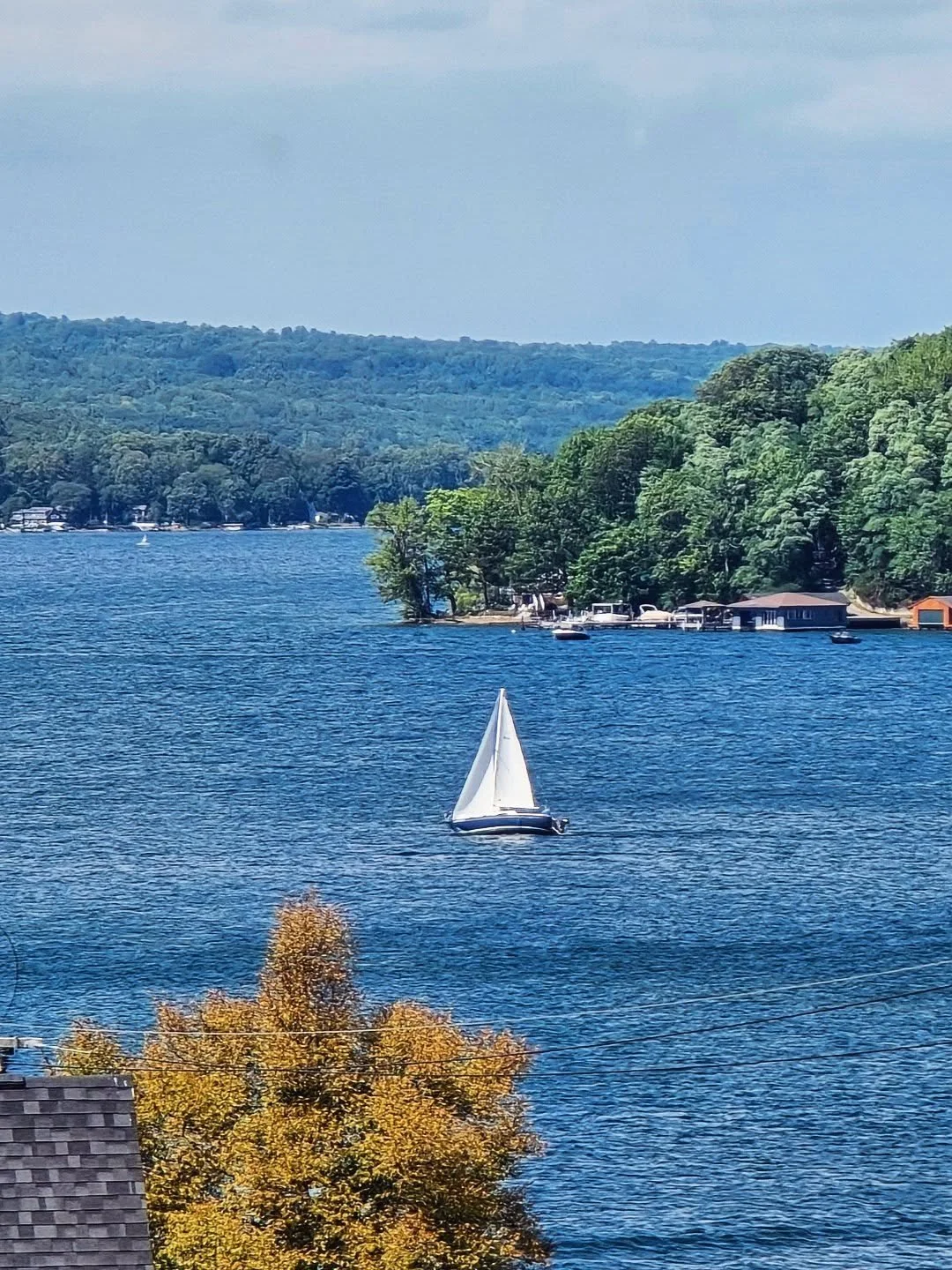Afternoons at Weis Vineyards capture everything we love about the Finger Lakes &mdash; a glass of local wine, the hum of conversation, and that easy calm that settles in when you pause to take in the view. Somewhere out there, a sailboat drifts acros