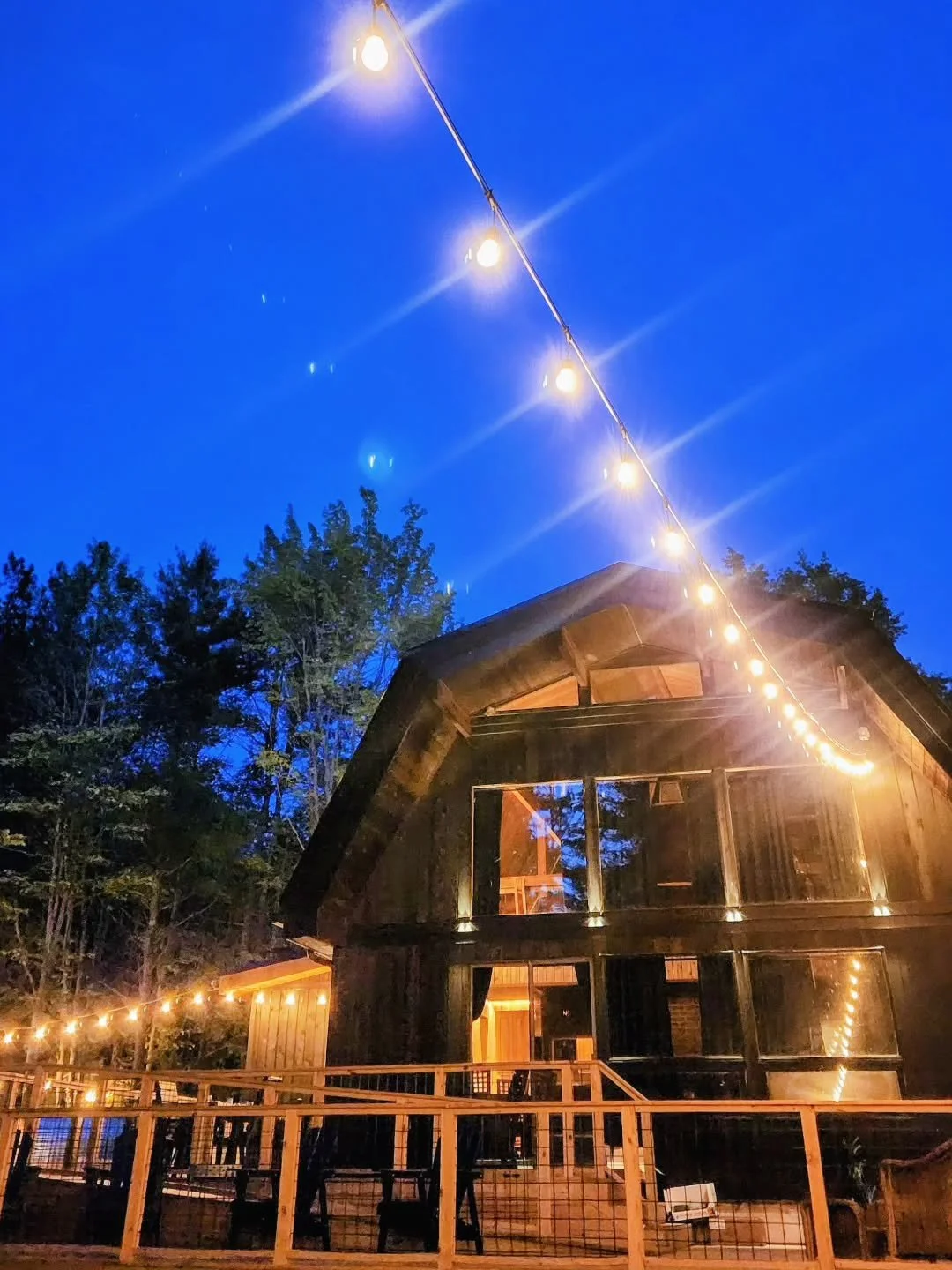 The best part of the day at The Hideaway might be when the sun goes down.

The forest gets quiet, the air cools off, and the bistro lights come on across the deck. Just enough glow to sit outside, talk a little, or do nothing at all.

Simple nights i