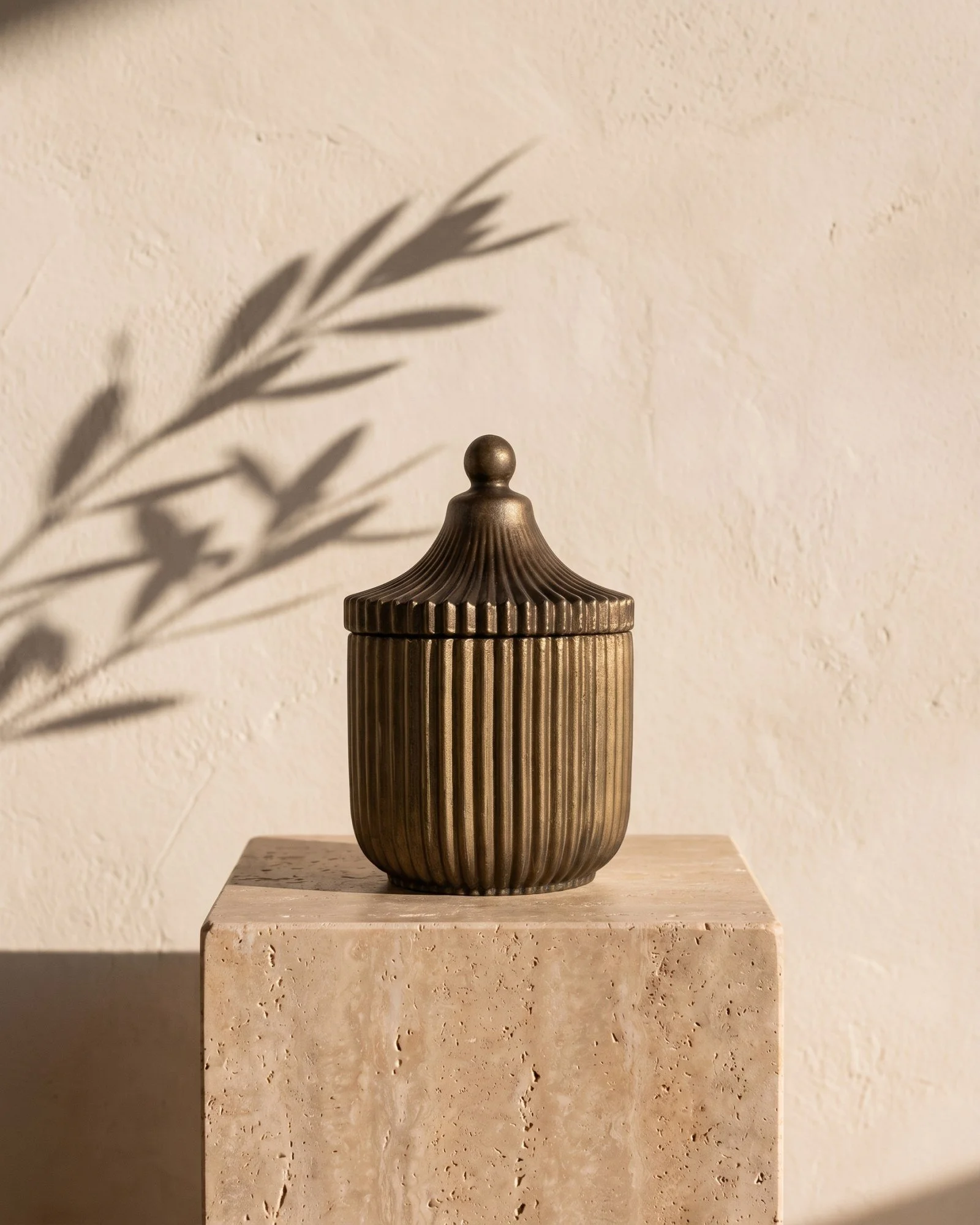 Dean + Oak Belaire Candle in Bronze, in morning light
