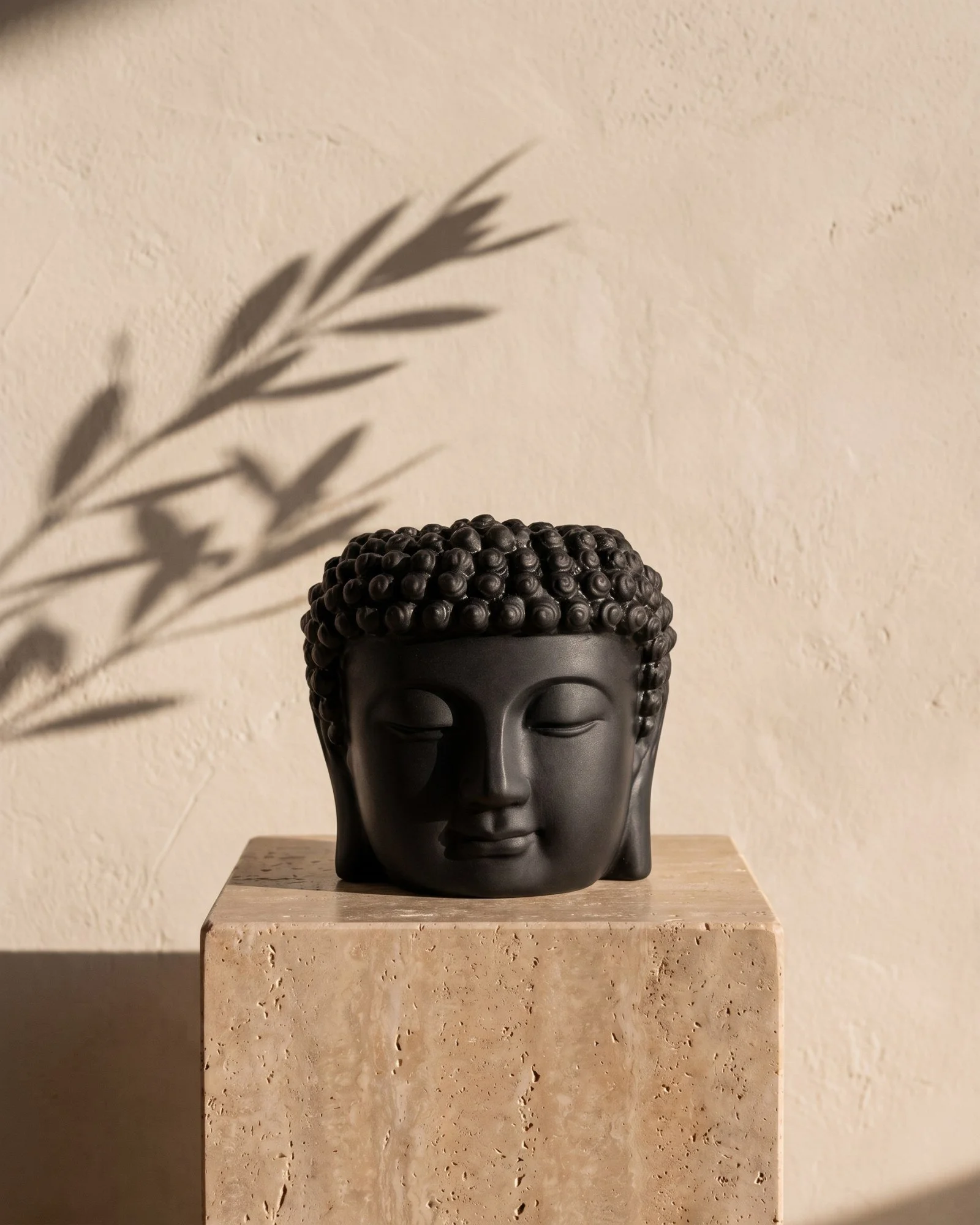 Dean + Oak Buddha Candle in Noir, in morning light