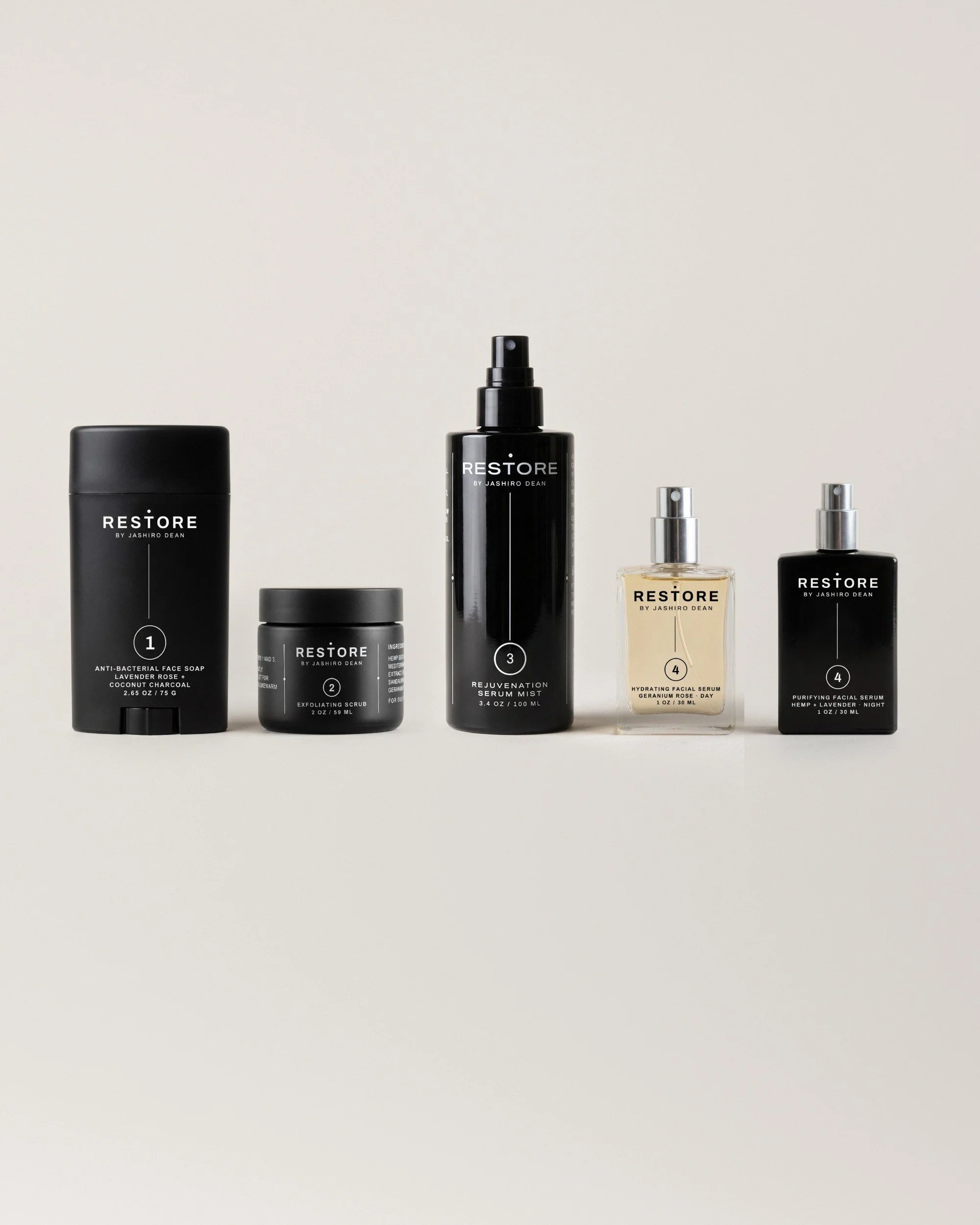 The Dean + Oak RESTORE Ritual Kit: face soap, scrub, serum mist and both serums, shown together