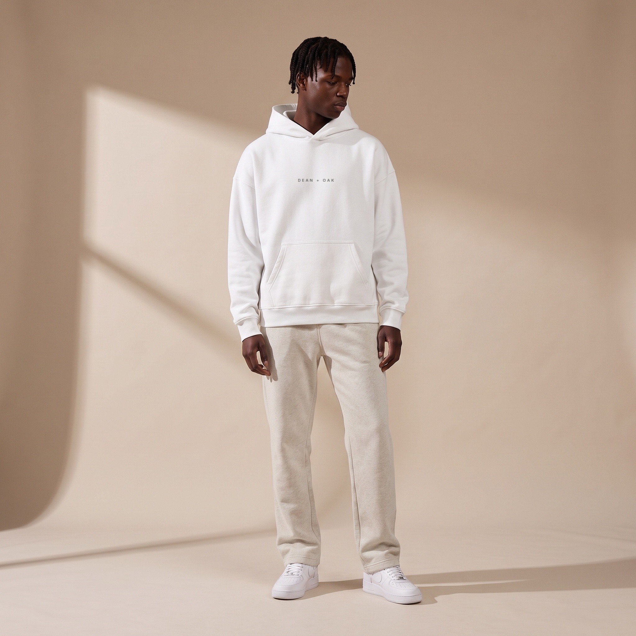 Dean + Oak heavyweight fleece hoodie in White, worn on a model