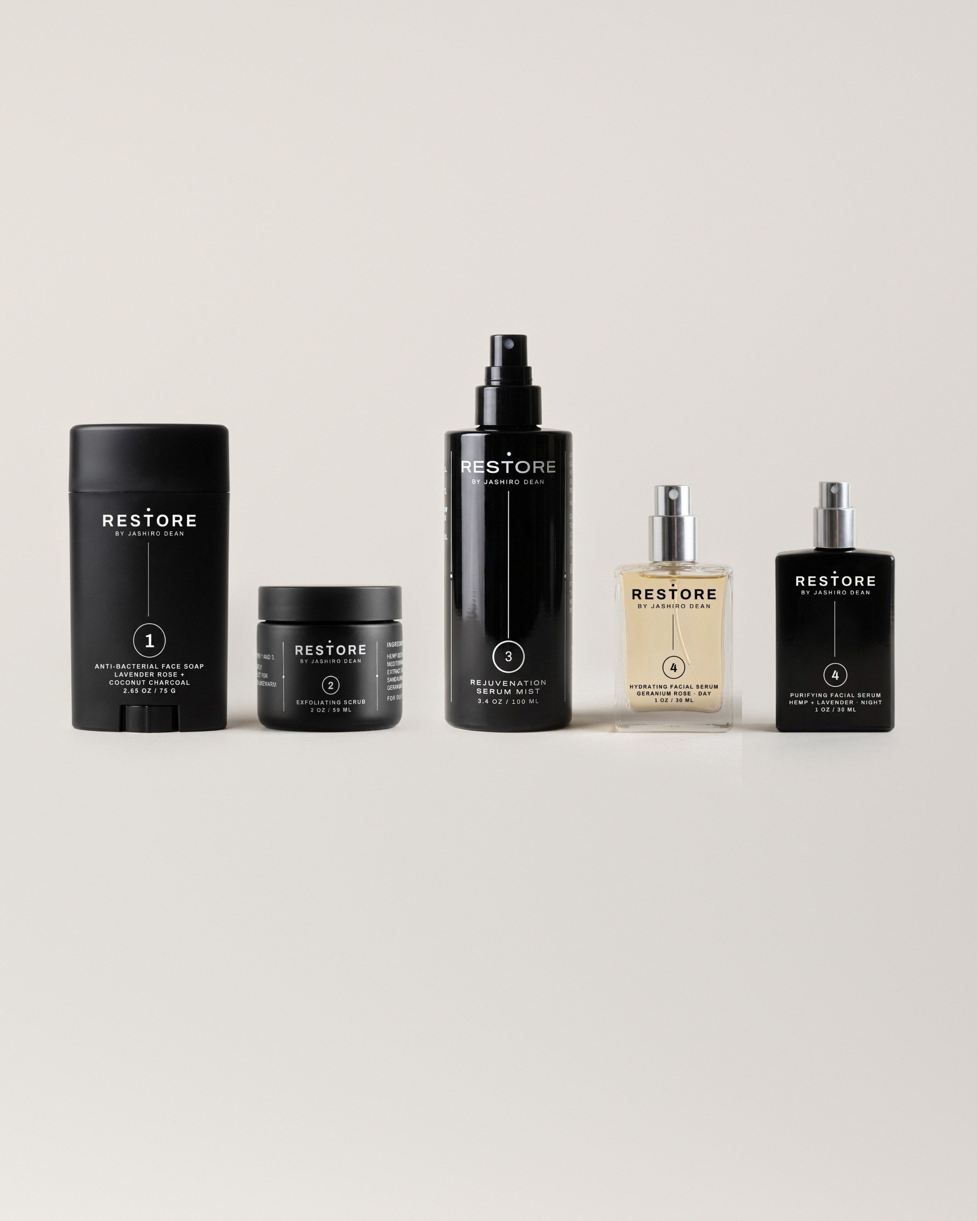 The Dean + Oak RESTORE Ritual Kit: face soap, scrub, serum mist and both serums, shown together