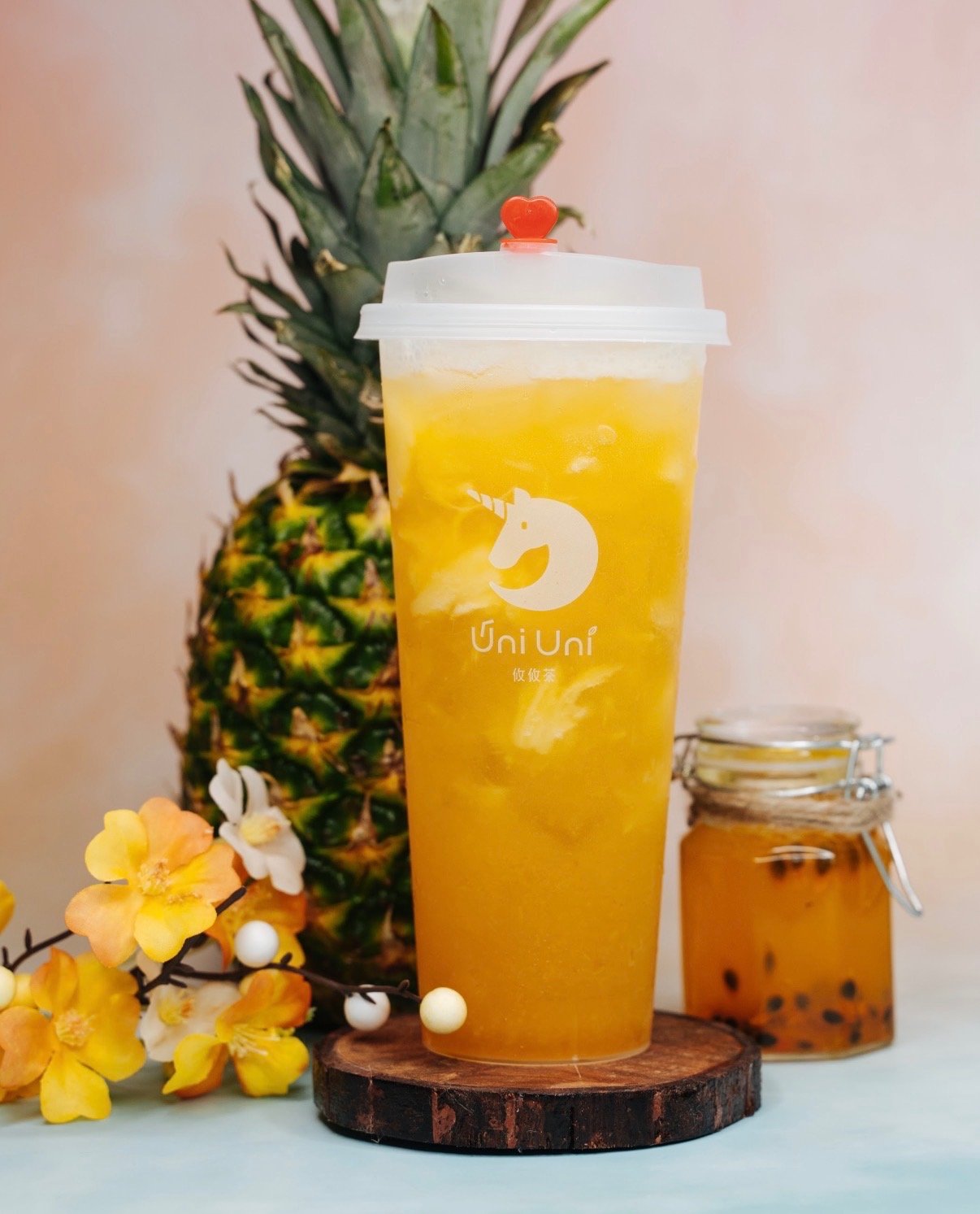 Pineapple passionfruit jasmine green tea with popping boba