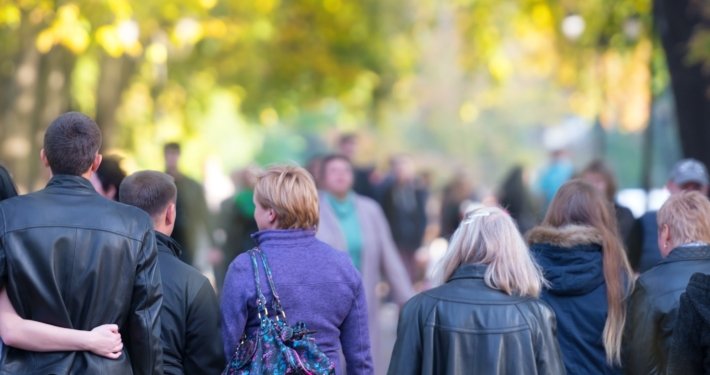 Photo of people walking around at an outdoor event