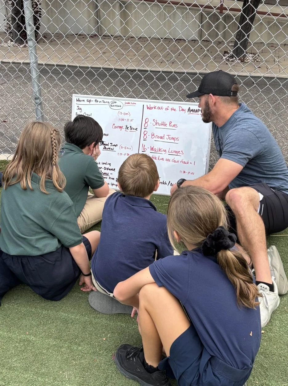 School volunteer working with kids at NCAE