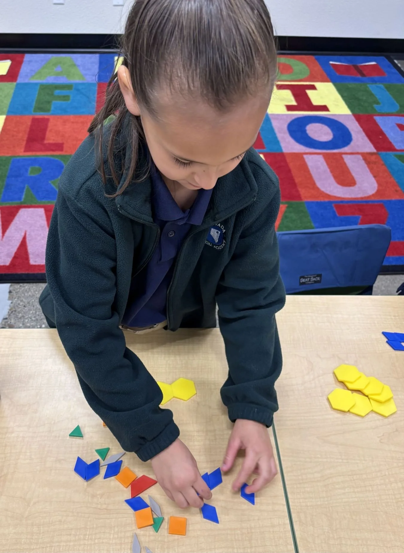 Kindergarten Student with shapes in class at NCAE
