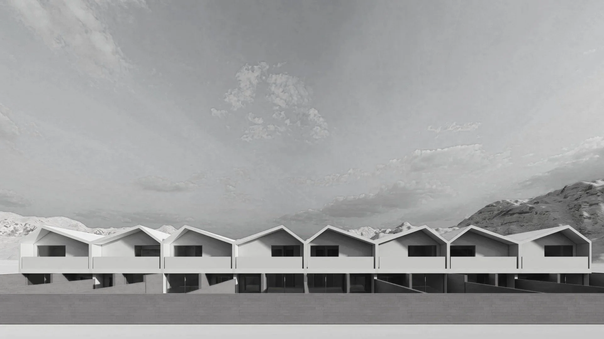 Modern architectural building with a series of connected white houses with pitched roofs, set against a mountainous landscape under a cloudy sky.