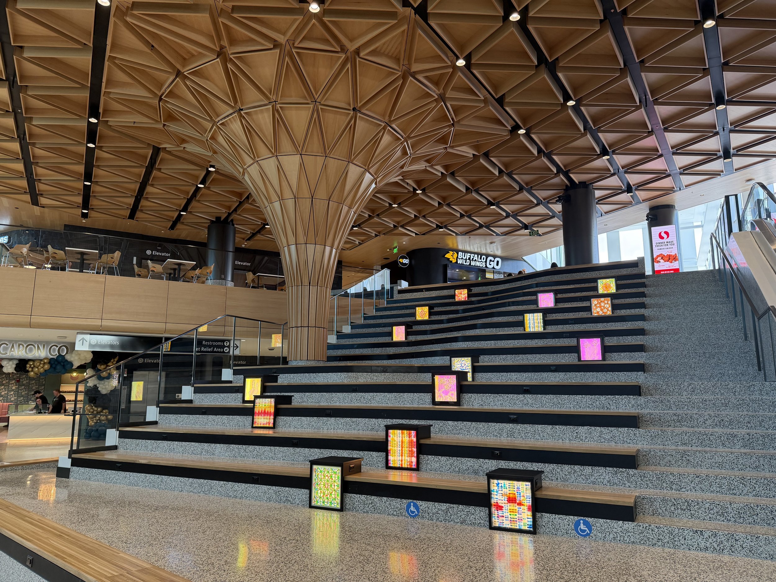 airport-interior-design-grand-stair-finishes-wood-ceiling-terrazzo.jpg