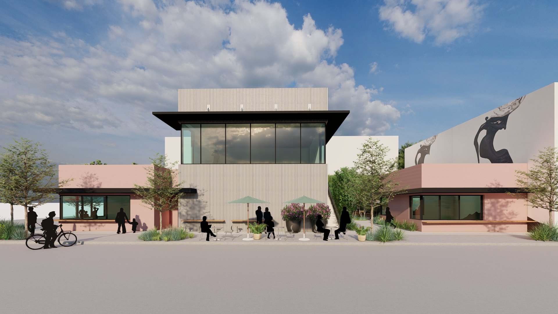 Modern retail facade design featuring a distinct pink stucco finish and large-format glazing to maximize natural light for the second-story tenants.