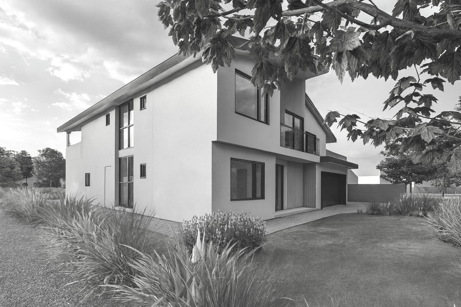 Modern two-story house with large windows, surrounded by a landscaped yard with grass, bushes, and trees, under a partly cloudy sky.