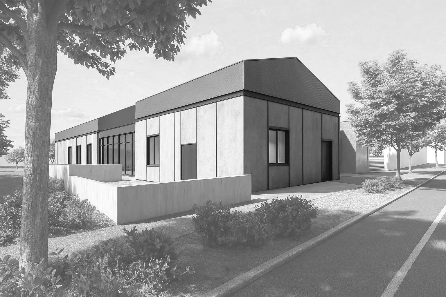 A modern commercial or institutional building with large windows, surrounded by trees and a sidewalk.