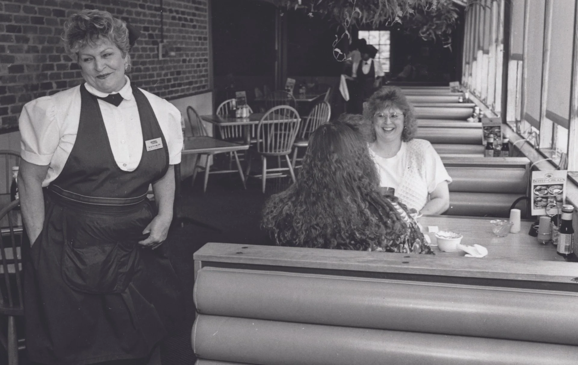  May 11, 1994; Fayetteville, NC, USA; Esther Swiderski, a waitress with Golden Corral for the past 20 years, jokes with Angela Bullard and Monica Jones. 