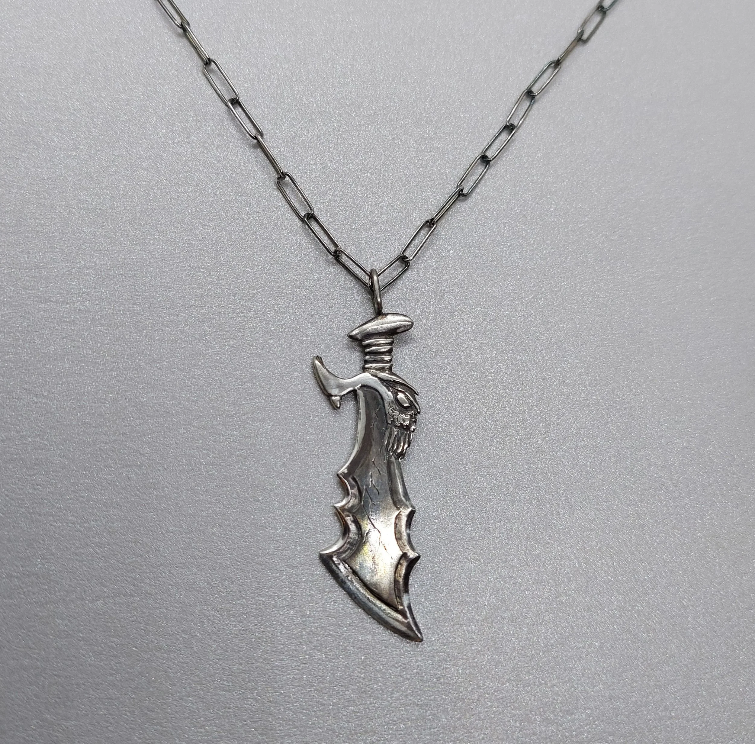 Handmade blades of chaos pendant