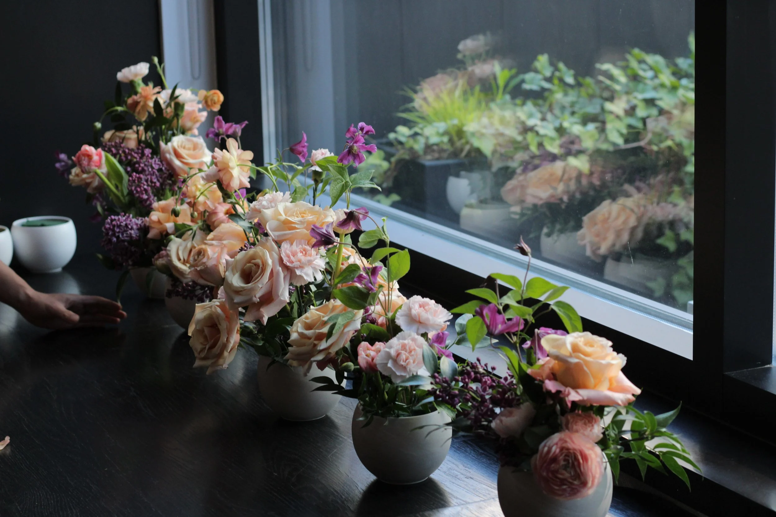 Group workshop moment at Anndore House Hotel Toronto during Grow Wild Wines activation, guests arranging flowers and socializing