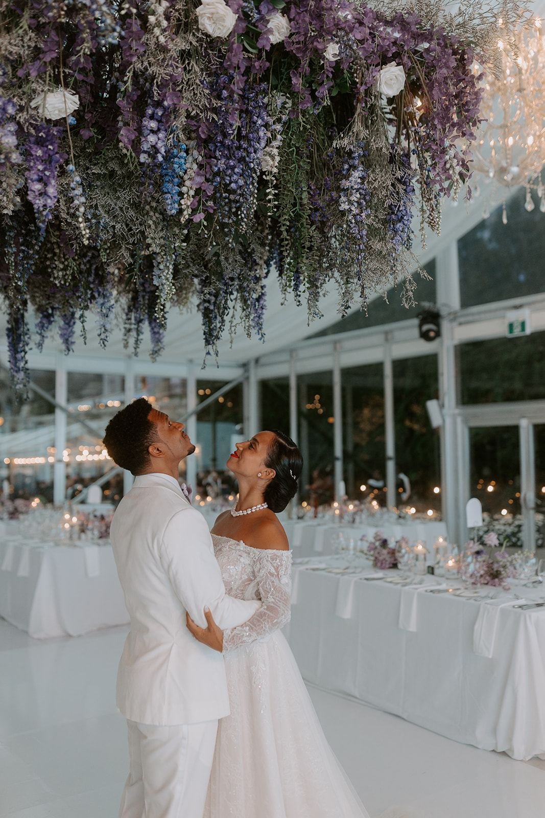 Casa Loma wedding reception transformed with suspended florals, luxury table décor and sustainable modern floral arrangements in Toronto.