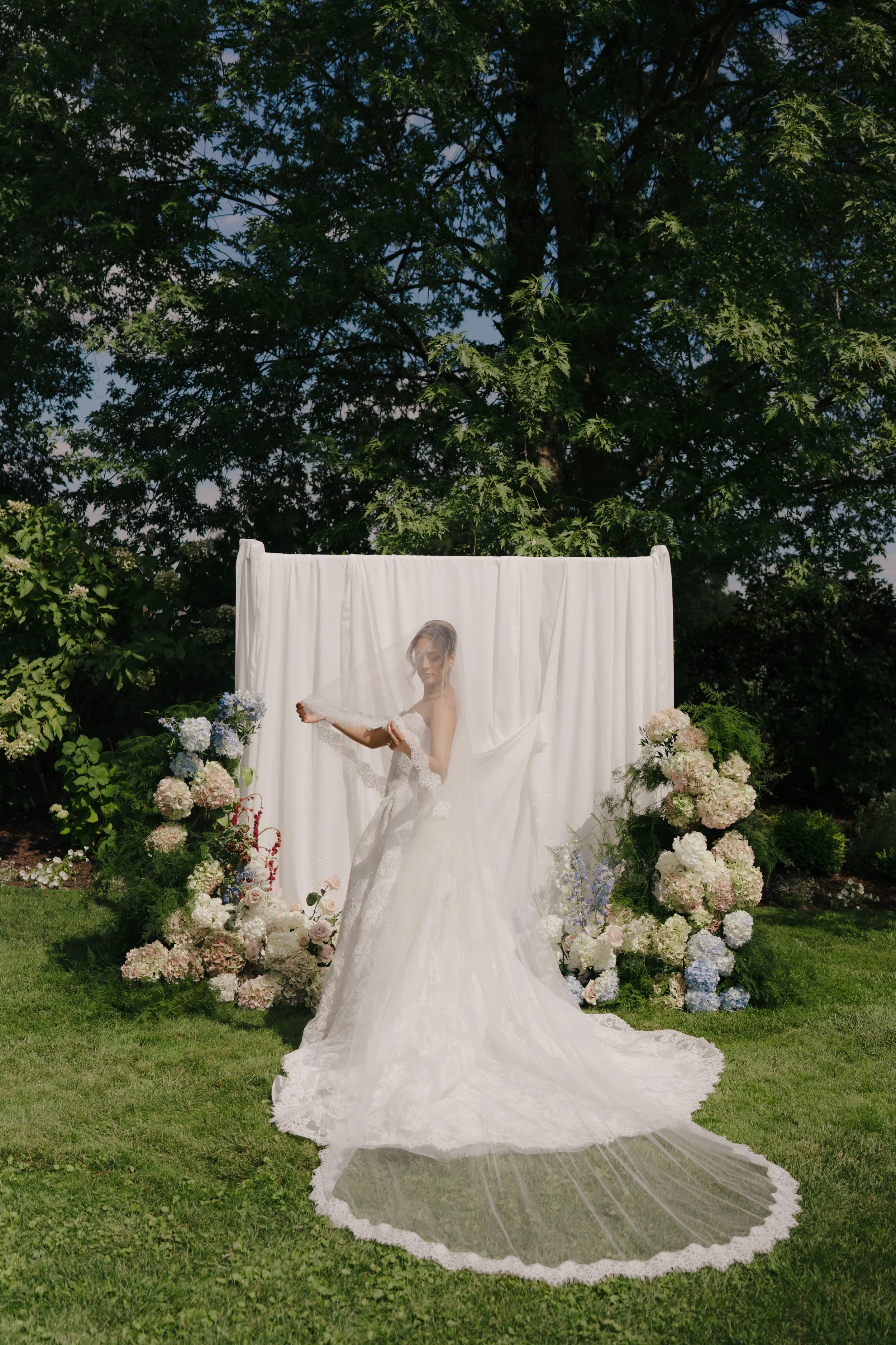 Full-room drapery with candlelit décor styled by Dereves, showcasing elevated wedding design Toronto.