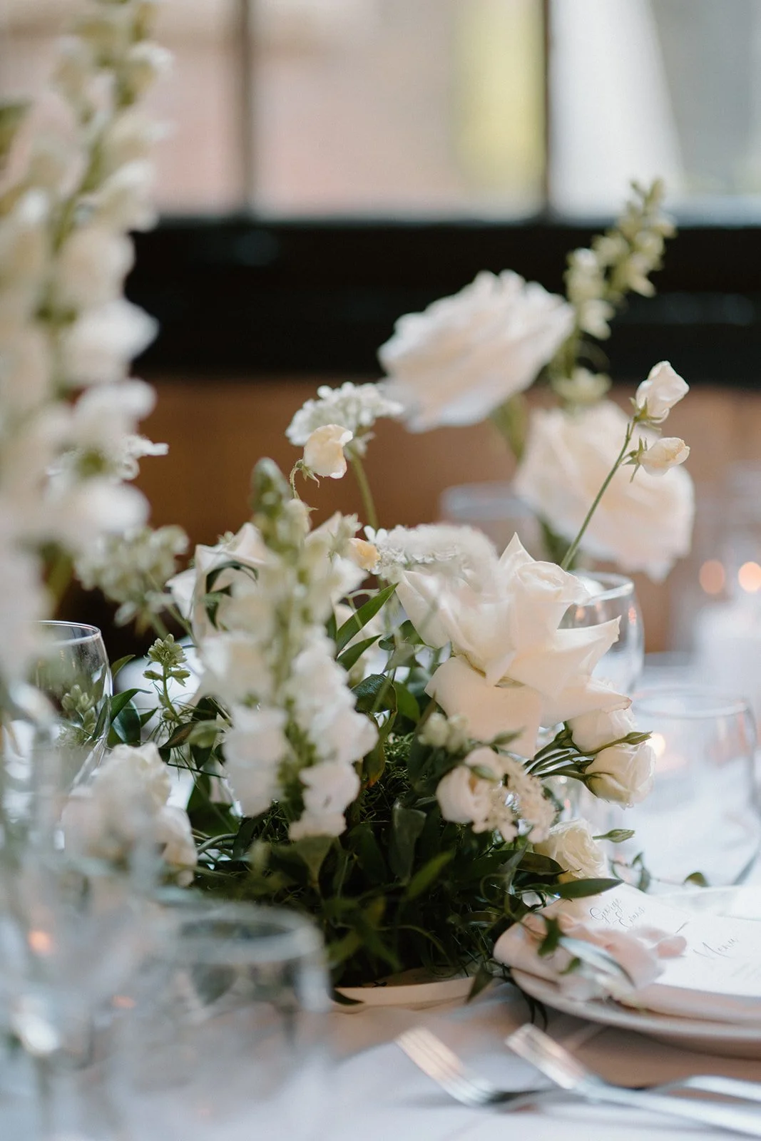 Soft white bouquets and delicate floral styling for a romantic wedding at Caffino, designed by Dereves, a Toronto wedding florist and luxury wedding planner.”