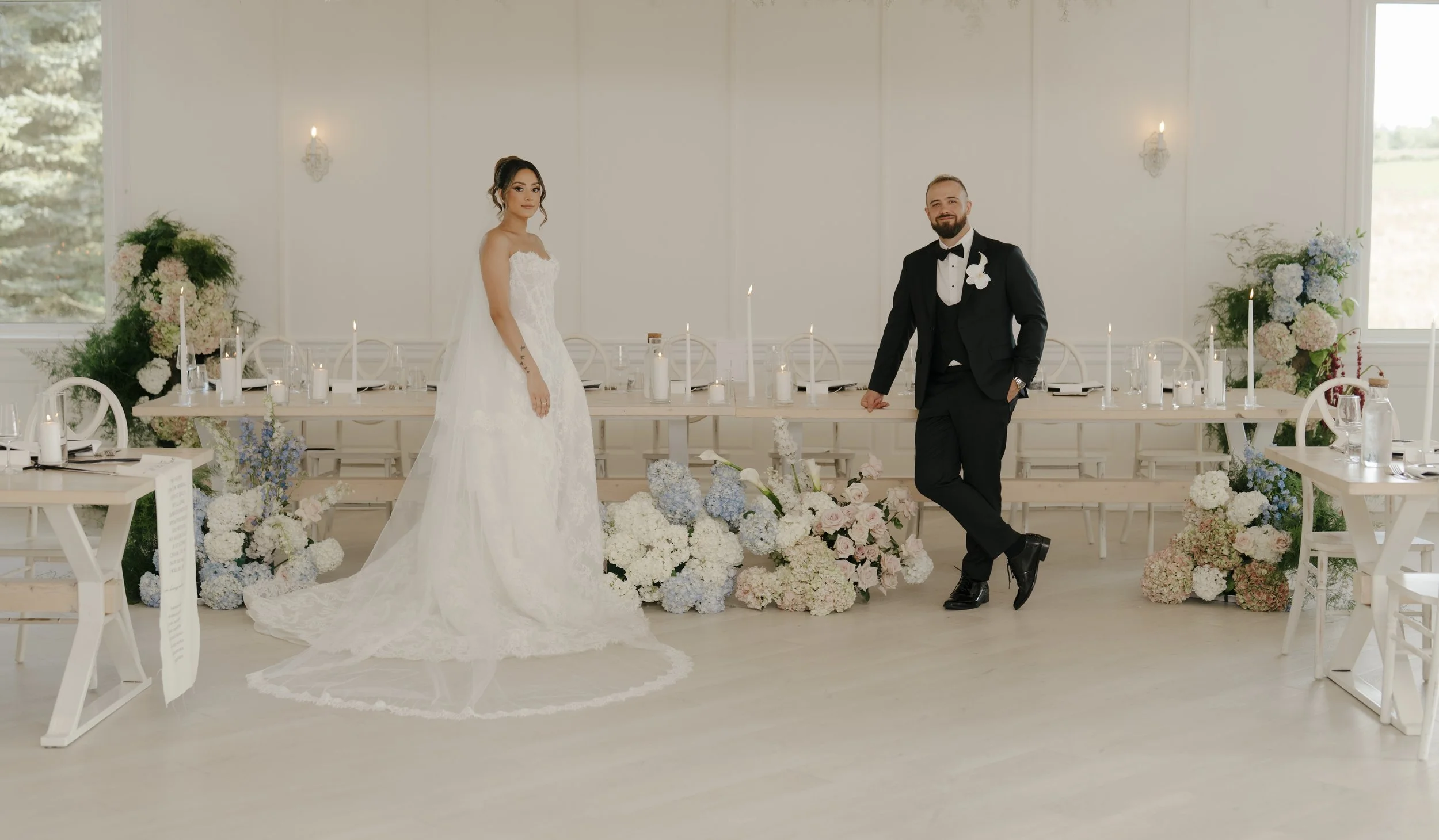 Modern white centerpiece with full blooms created by Dereves Studio, premier Toronto wedding florist for luxury weddings.