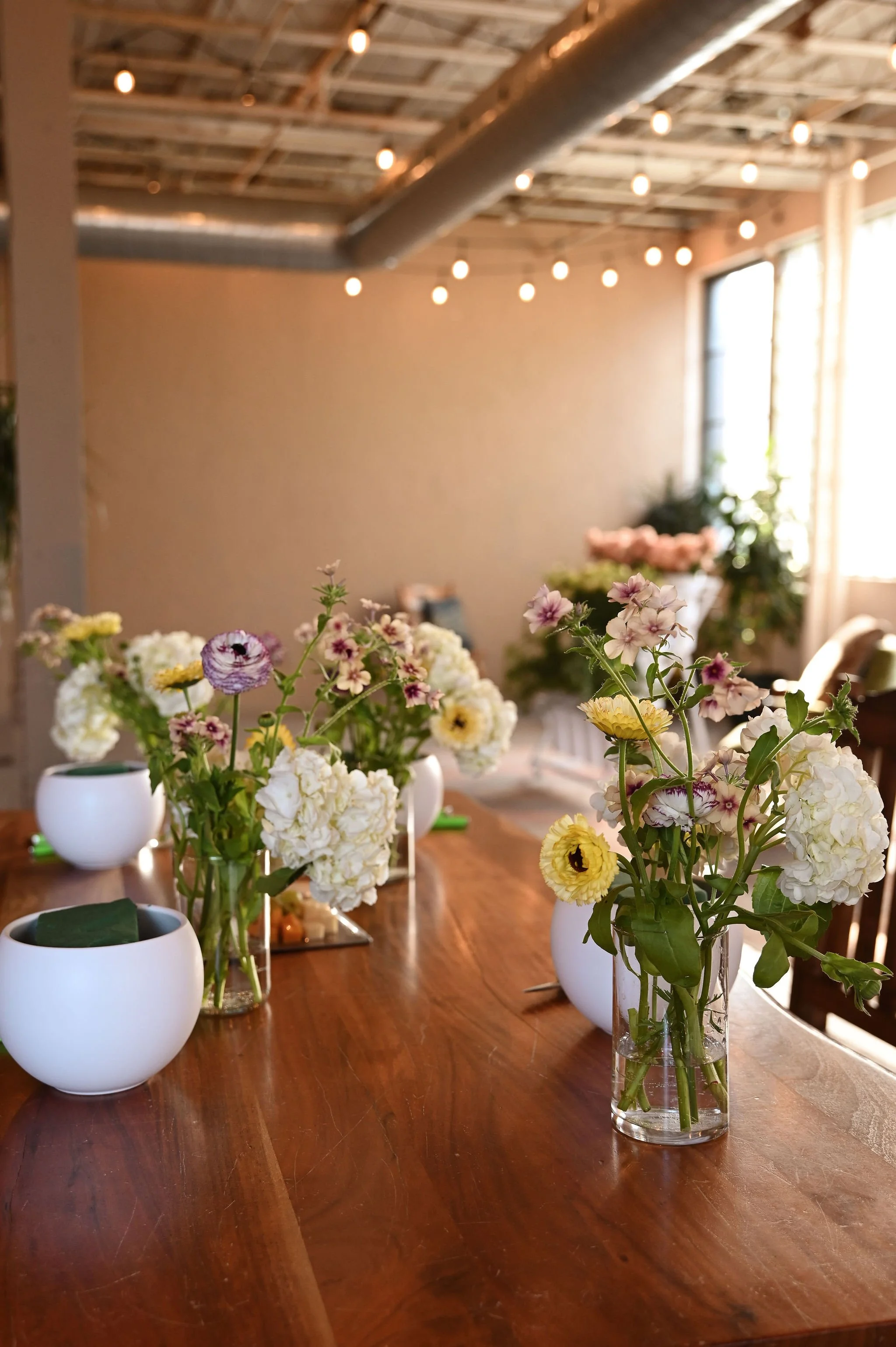 Fresh flowers and vases set up for a Flower Socials workshop in Toronto.