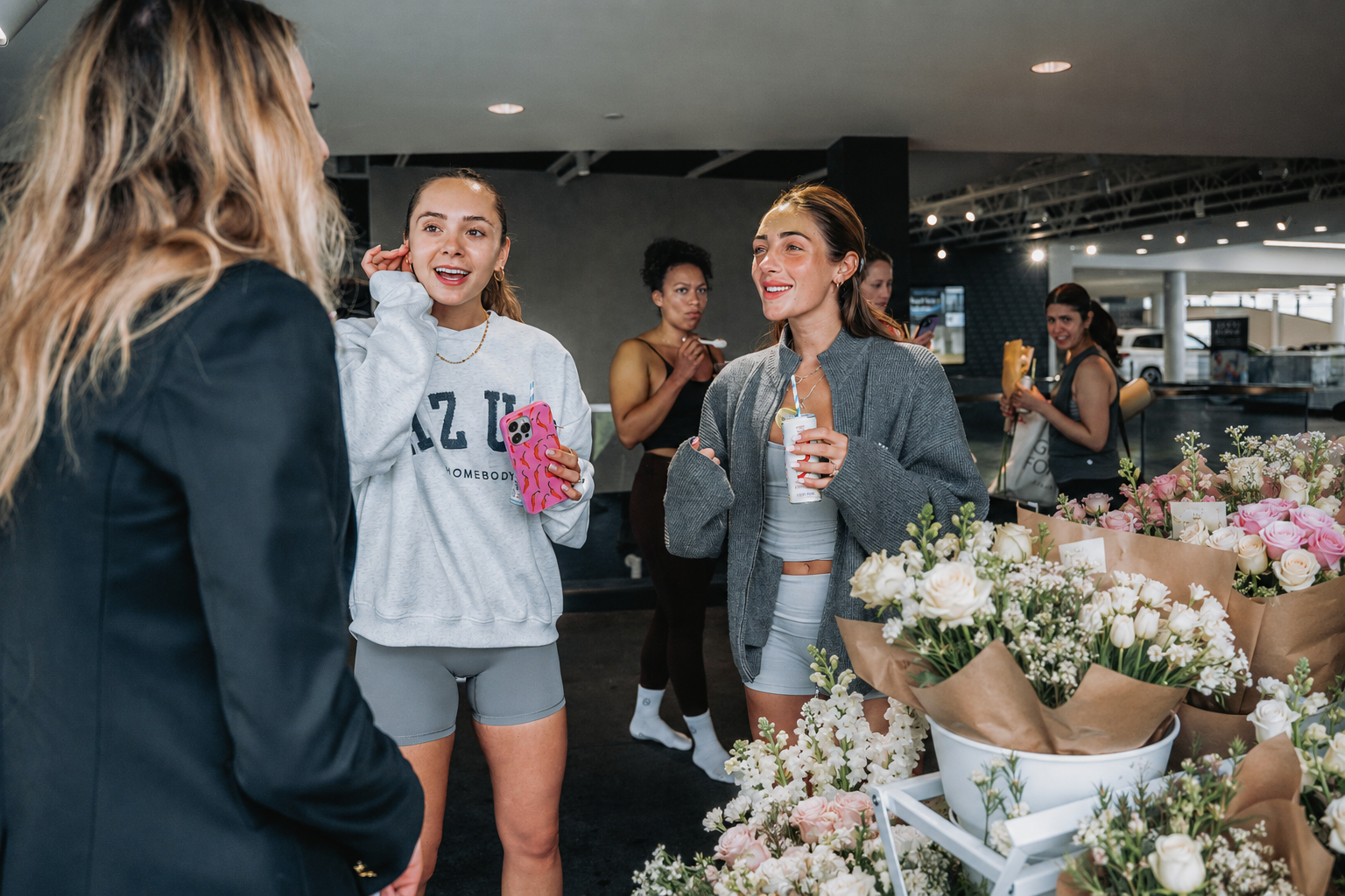 Guests creating their own bouquets at a Toronto flower bar experience for a corporate event