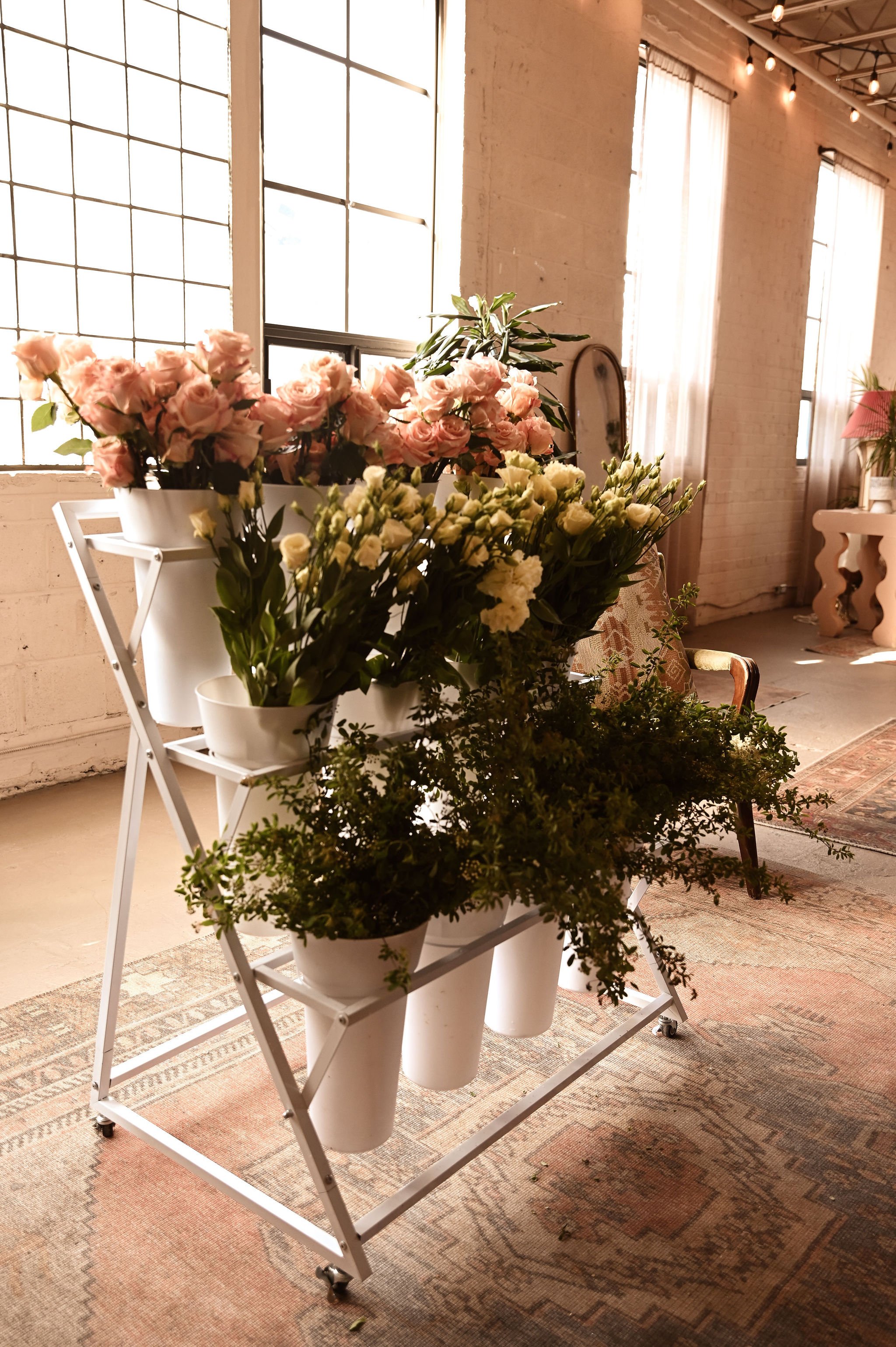 A styled flower bar in Toronto with fresh blooms for guests to build their own bouquets.
