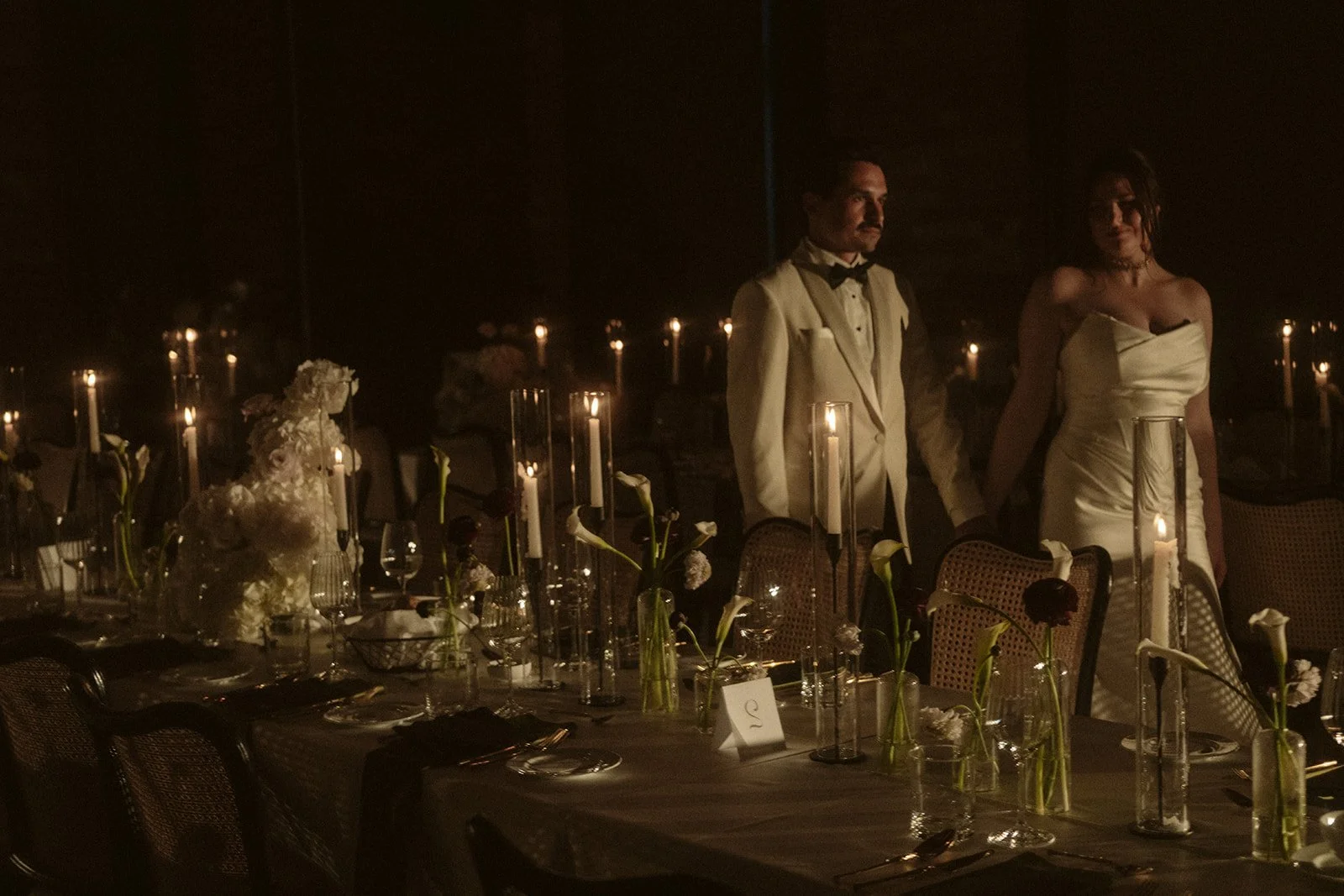 Modern wedding flowers at The Gladstone House in downtown Toronto, featuring contemporary floral arrangements and candlelit reception décor by Derêves Studio.