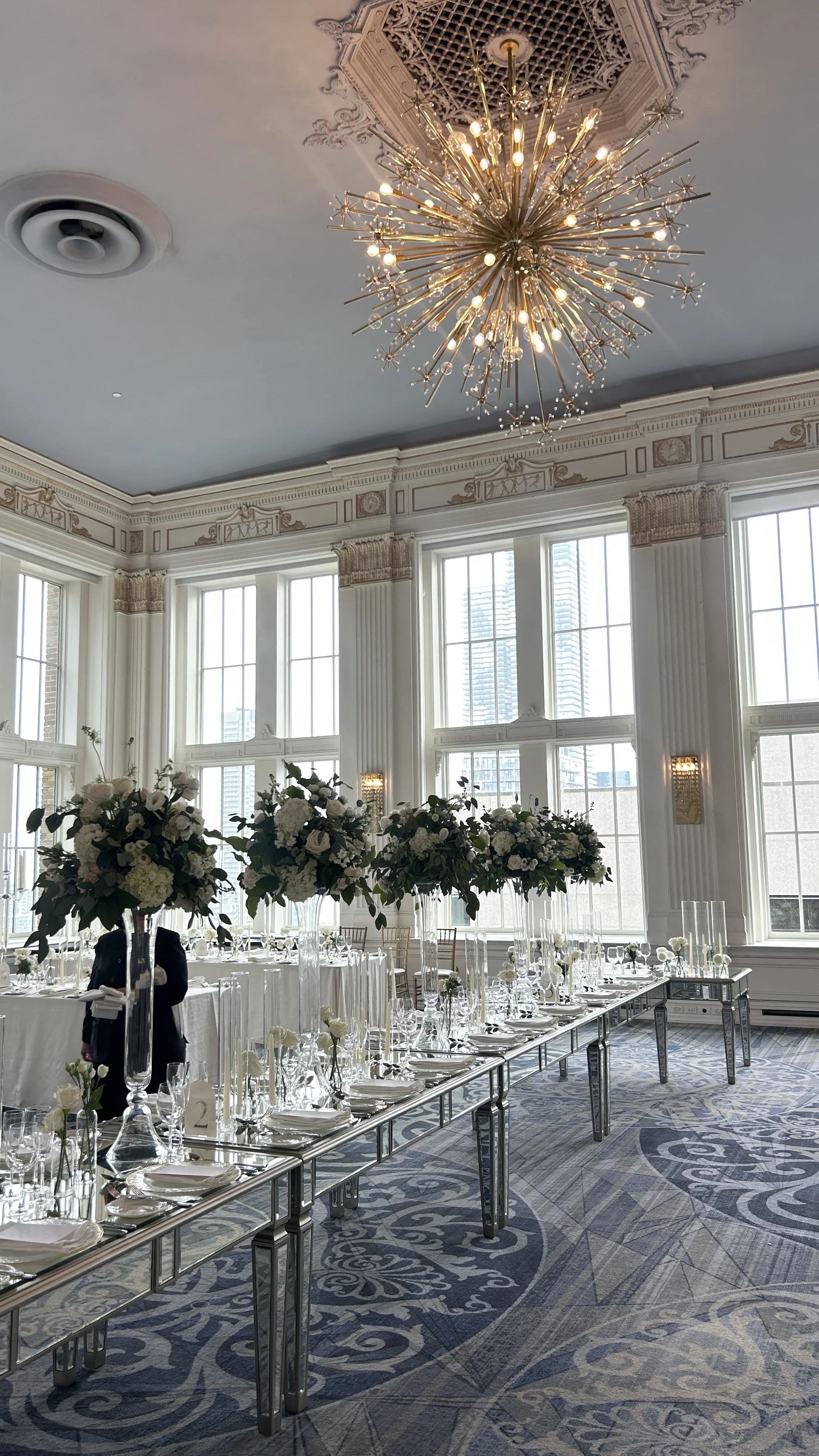 Full-room transformation with draping, candles, and florals styled by Dereves Studio, Toronto luxury wedding planner.