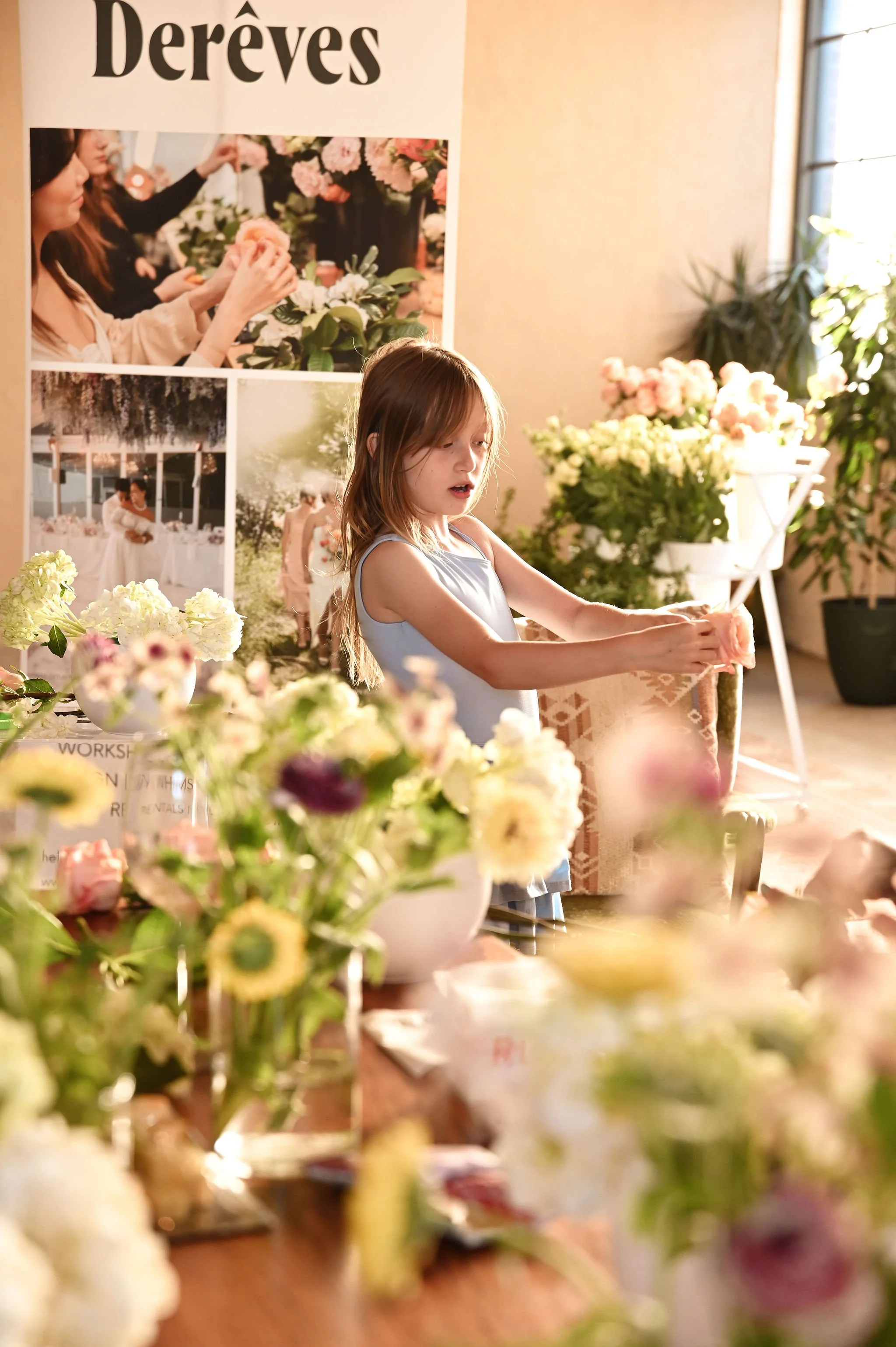 A Toronto flower workshop setup with buckets of fresh blooms and floral supplies.