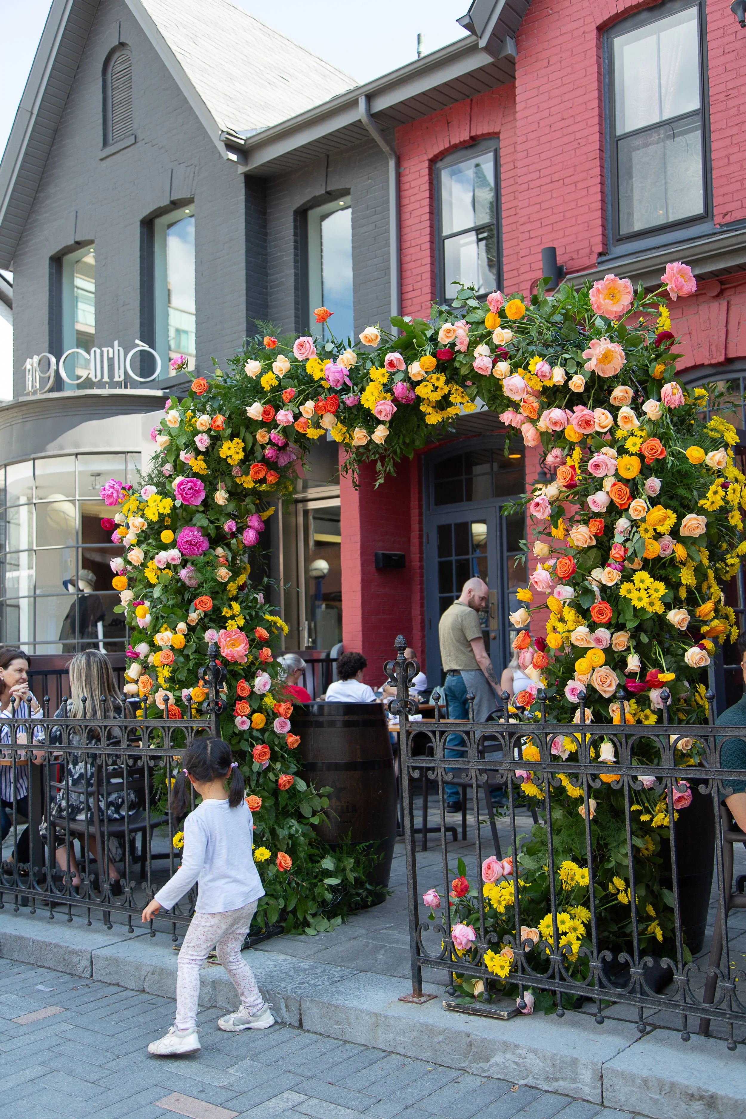 Floral photo moment for a Toronto restaurant entrance event with statement sustainable flowers